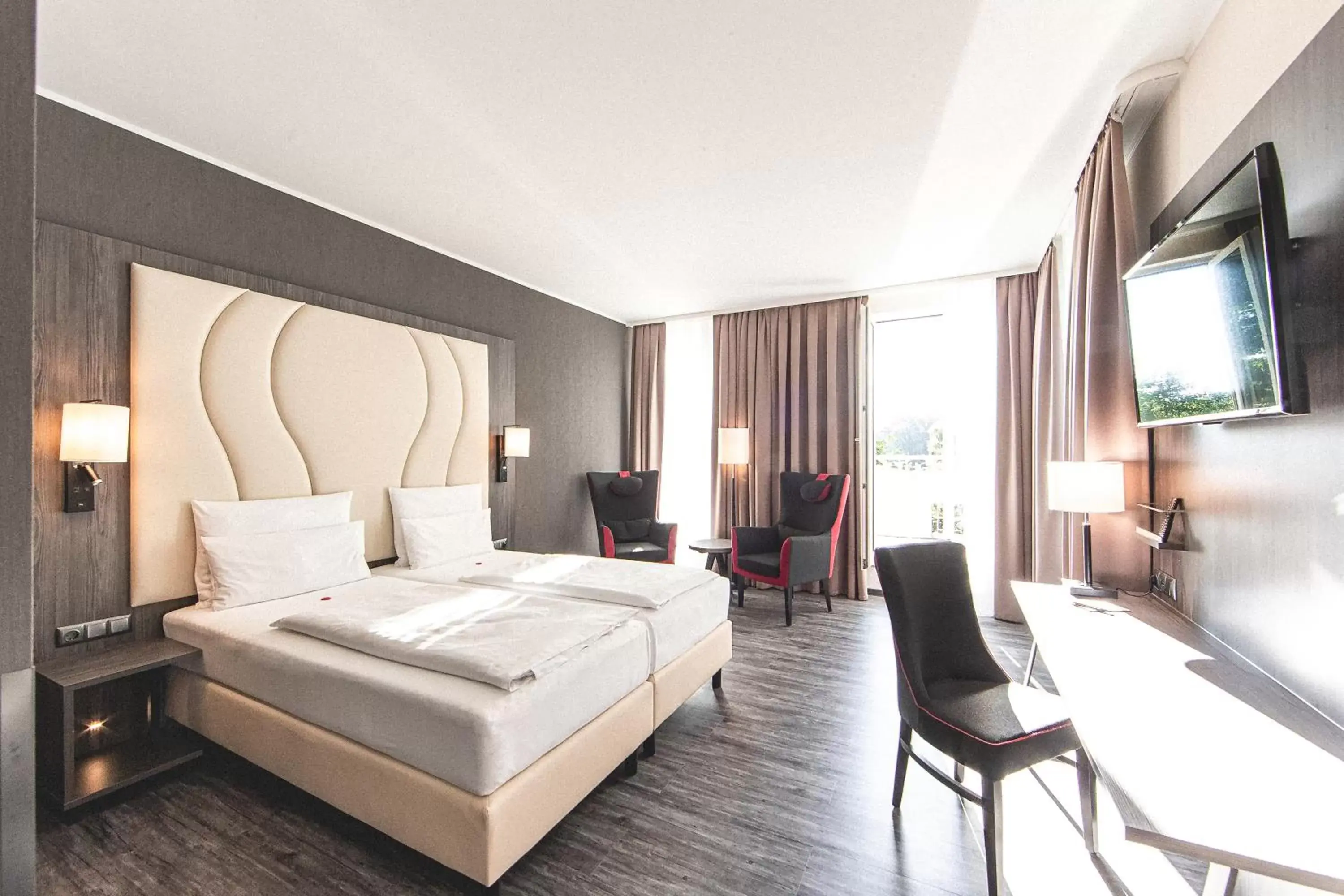 Bedroom in PLAZA Premium Parkhotel Norderstedt