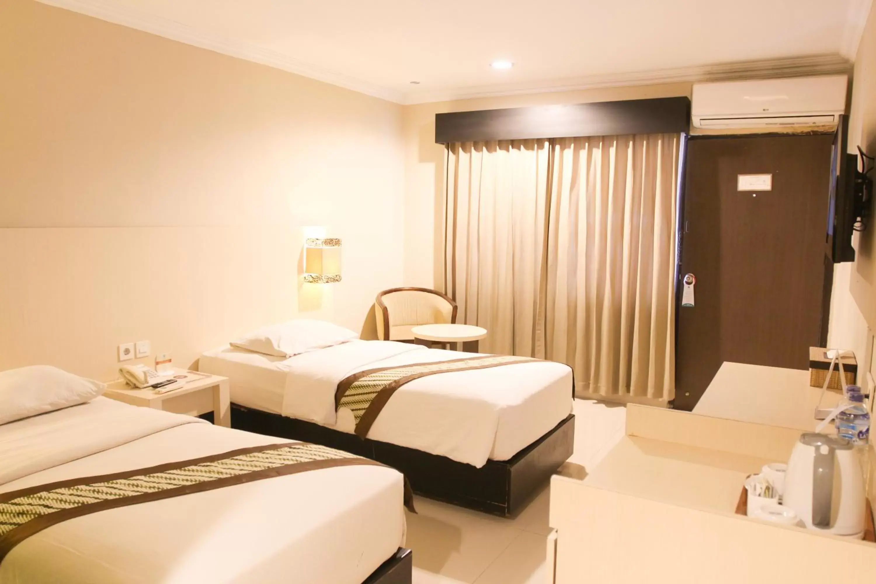 Bed in Cakra Kusuma Hotel