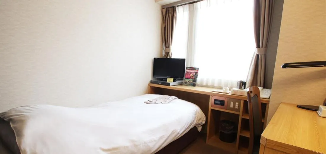 Bed in Takamatsu City Hotel