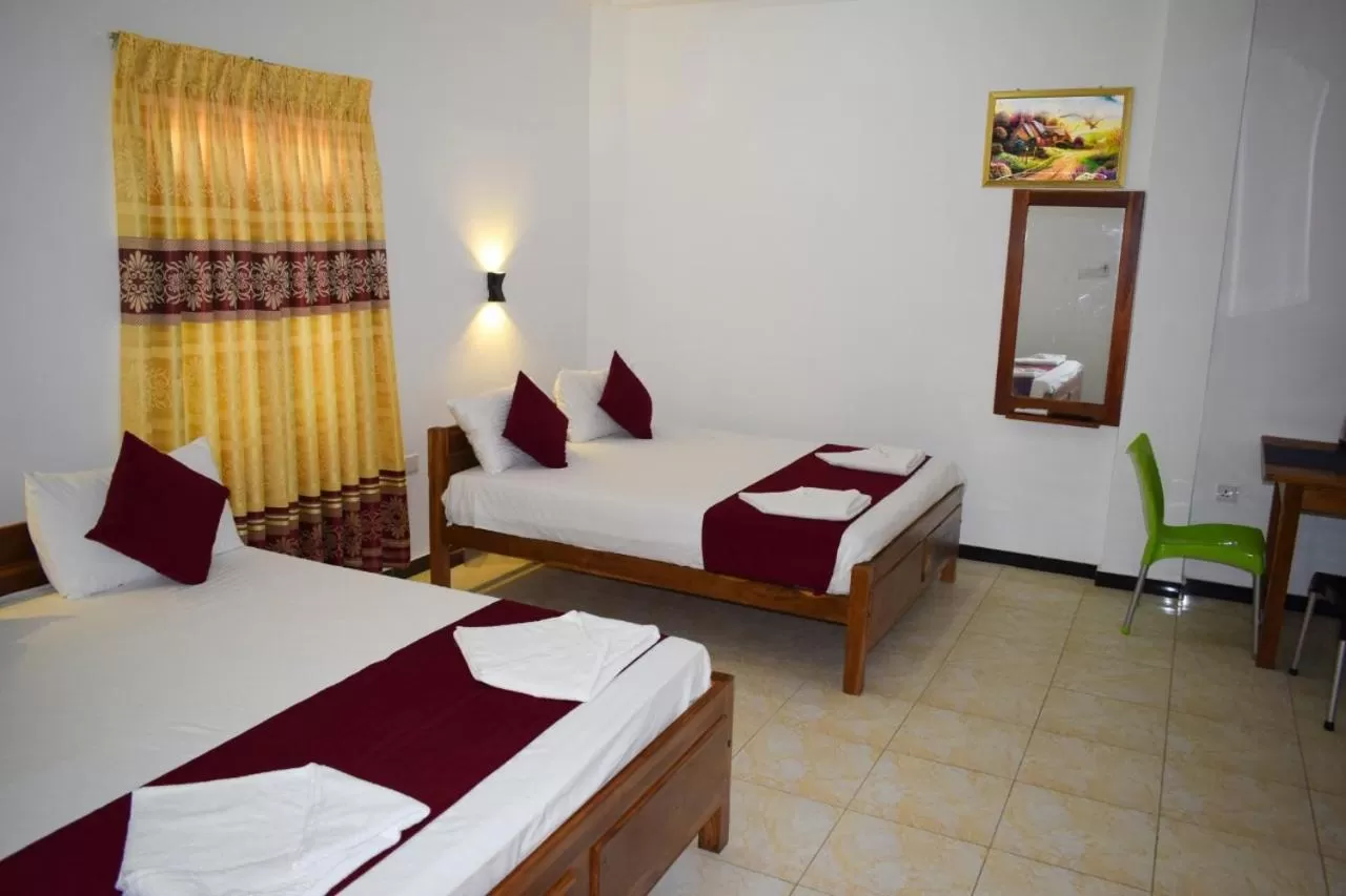 Bed in Hotel Theevanni Inn