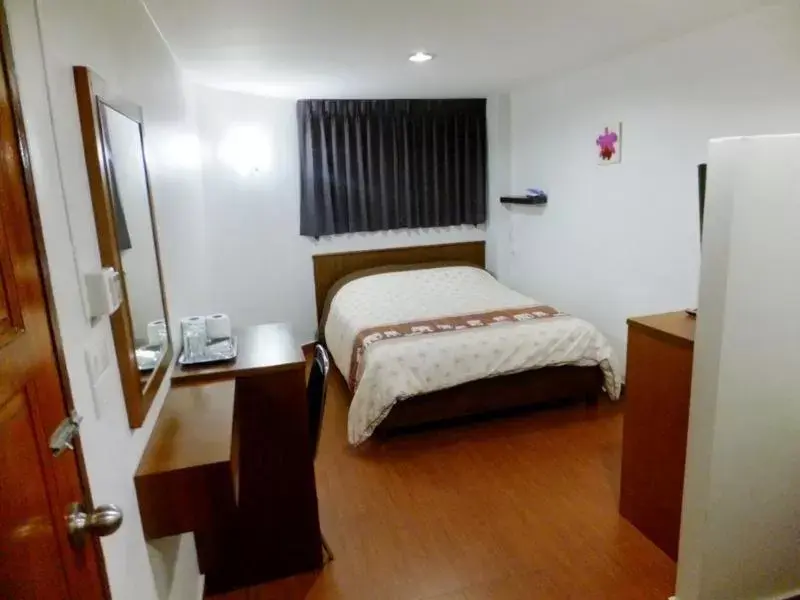 Bed in Orchid Inn Bed in Orchid Inn