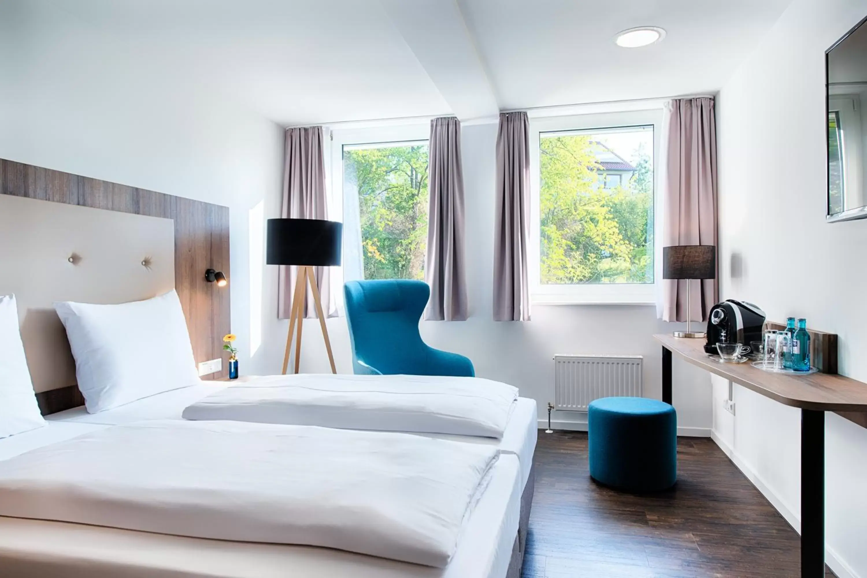 Photo of the whole room, Bed in ACHAT Hotel Stuttgart Zuffenhausen