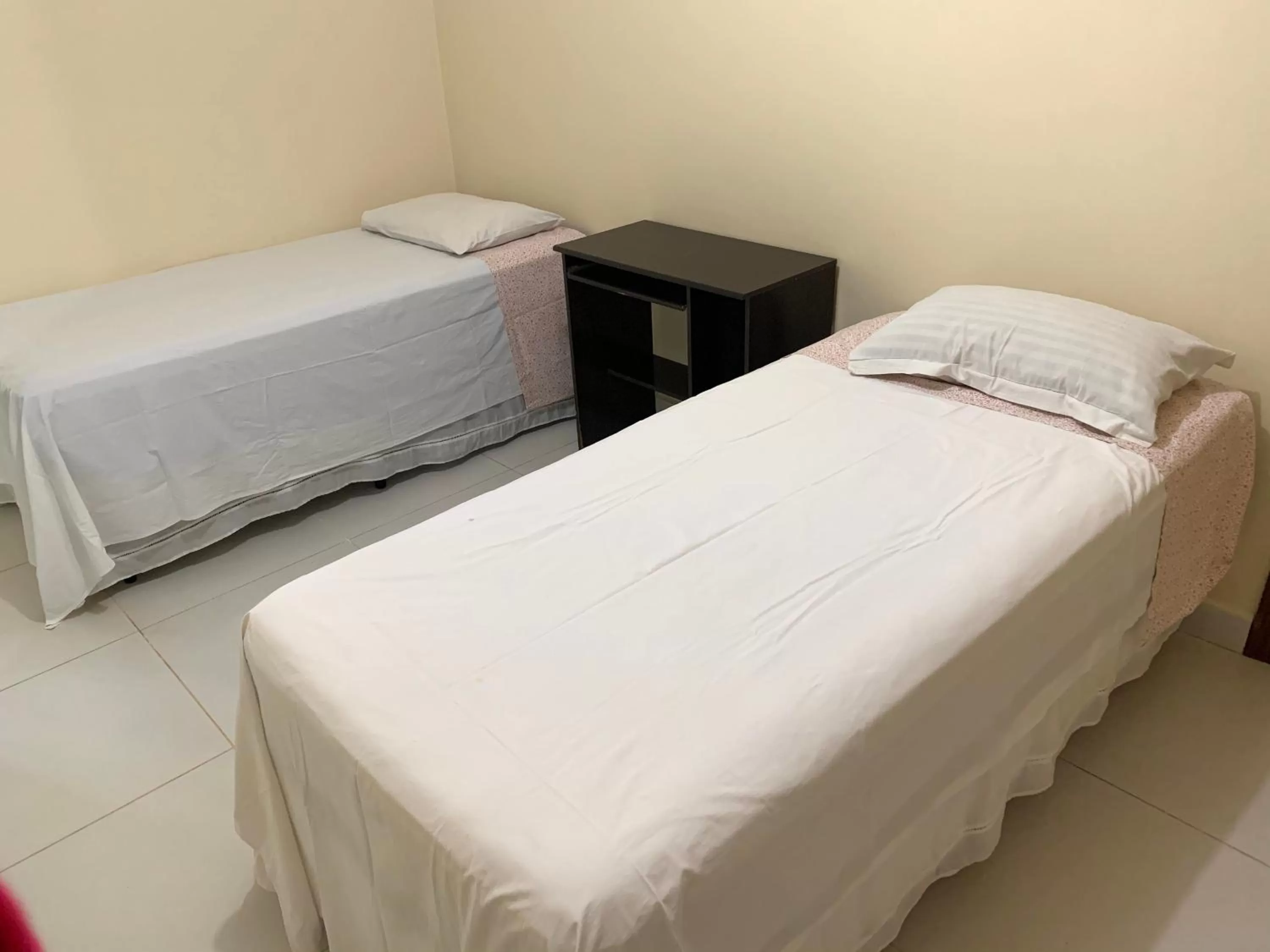 Bed in Pousada Jardim Brasília