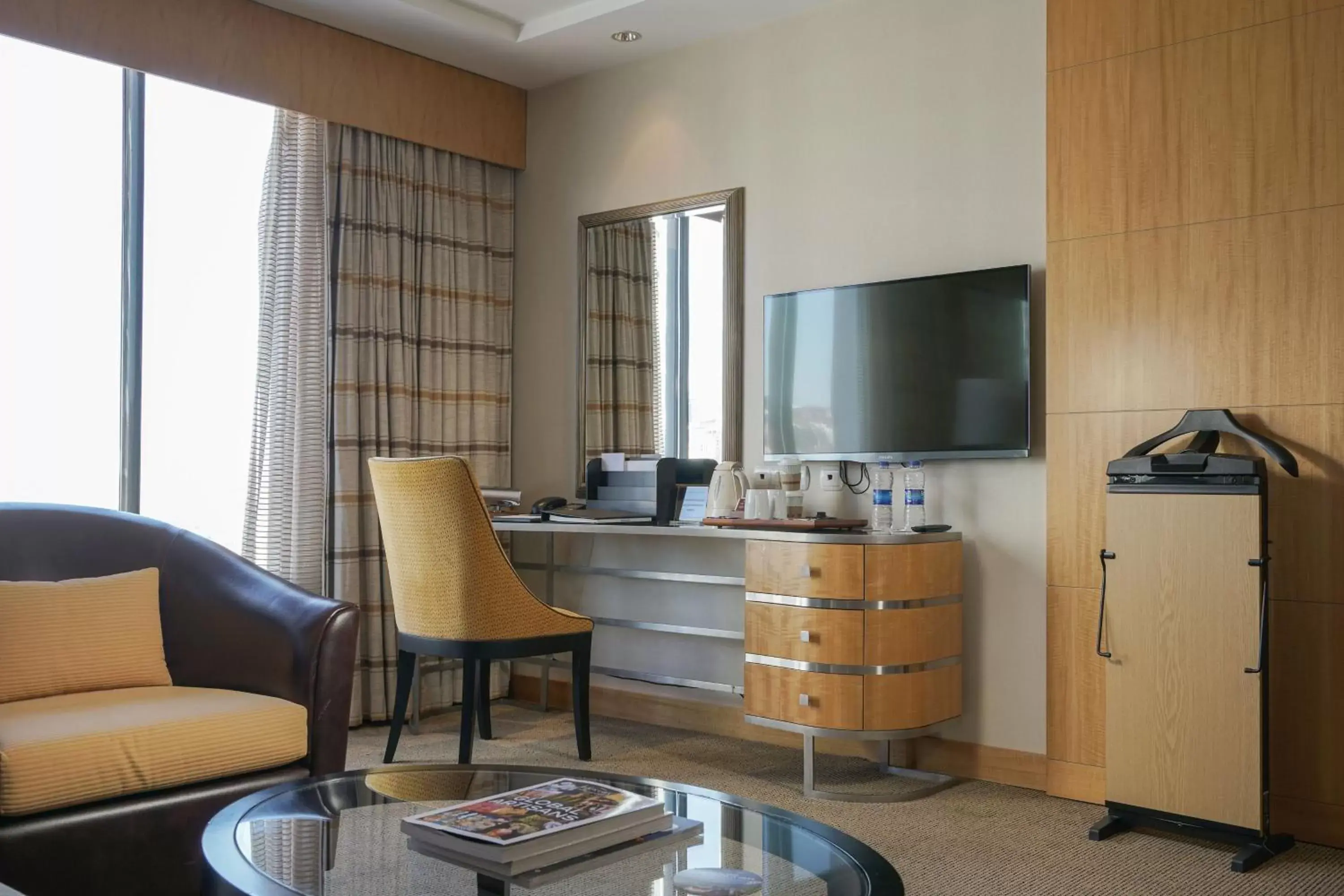 Photo of the whole room, TV/Entertainment Center in Lugal, A Luxury Collection Hotel