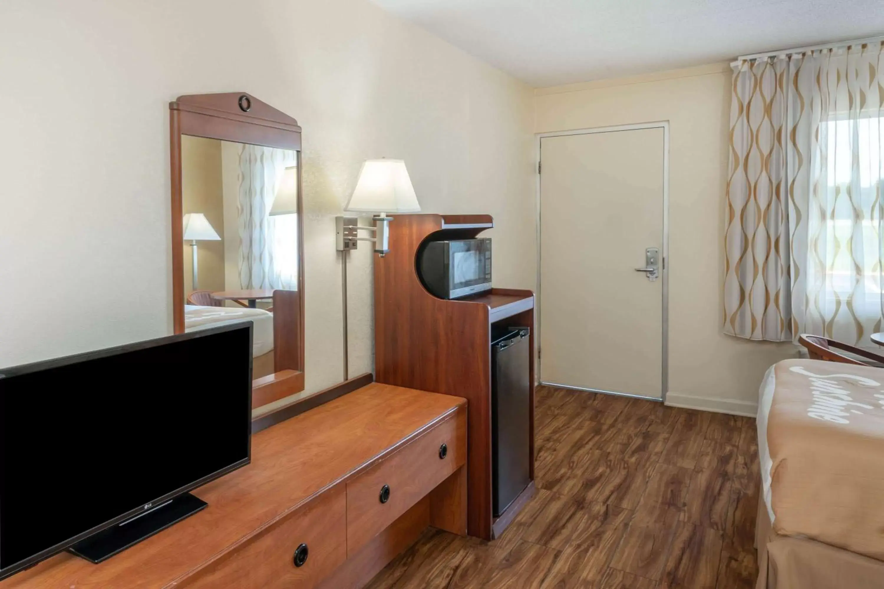 Photo of the whole room, TV/Entertainment Center in Days Inn by Wyndham Clarksville TN