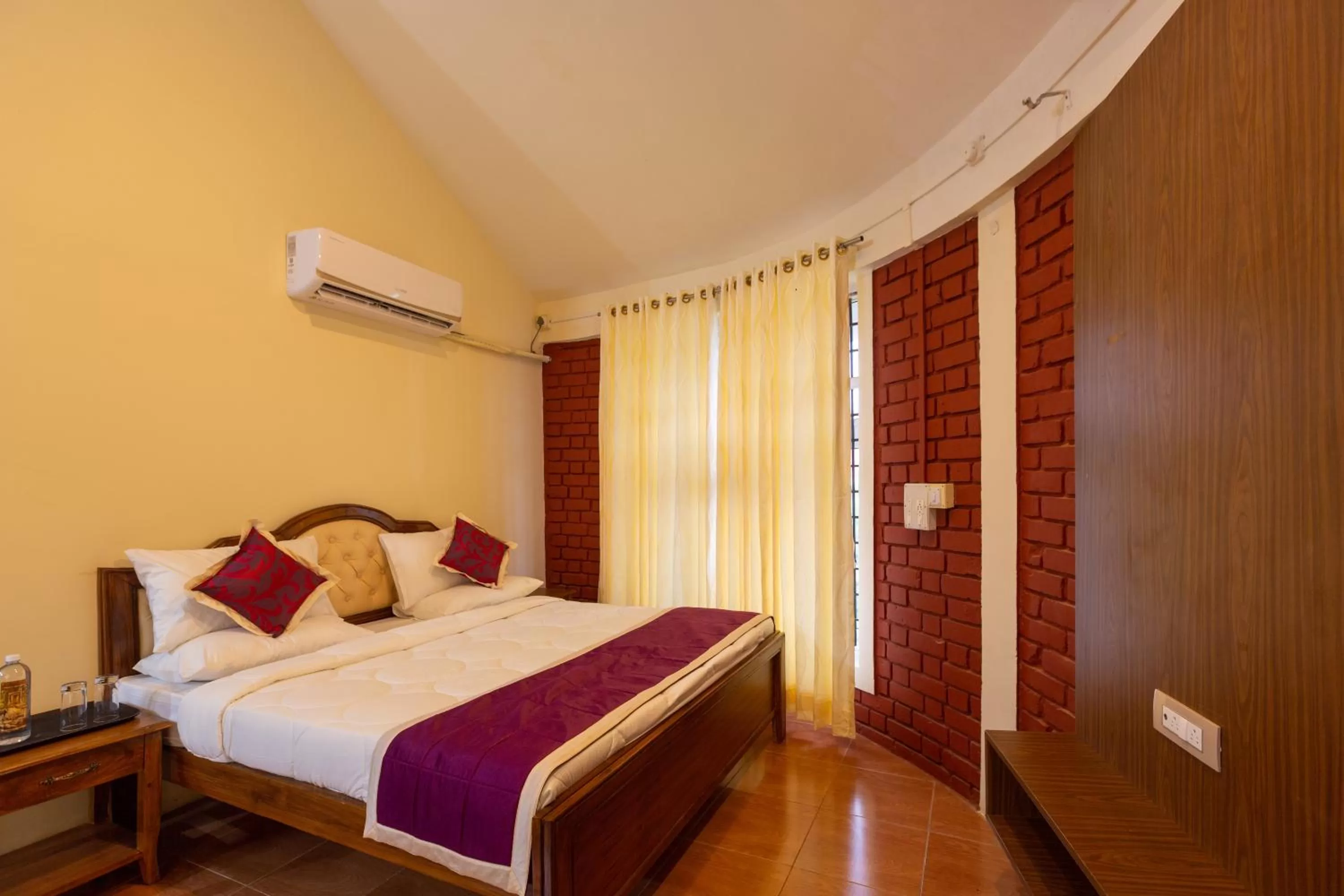 Bed in KSTDC Hotel Mayura Krishna Almatti