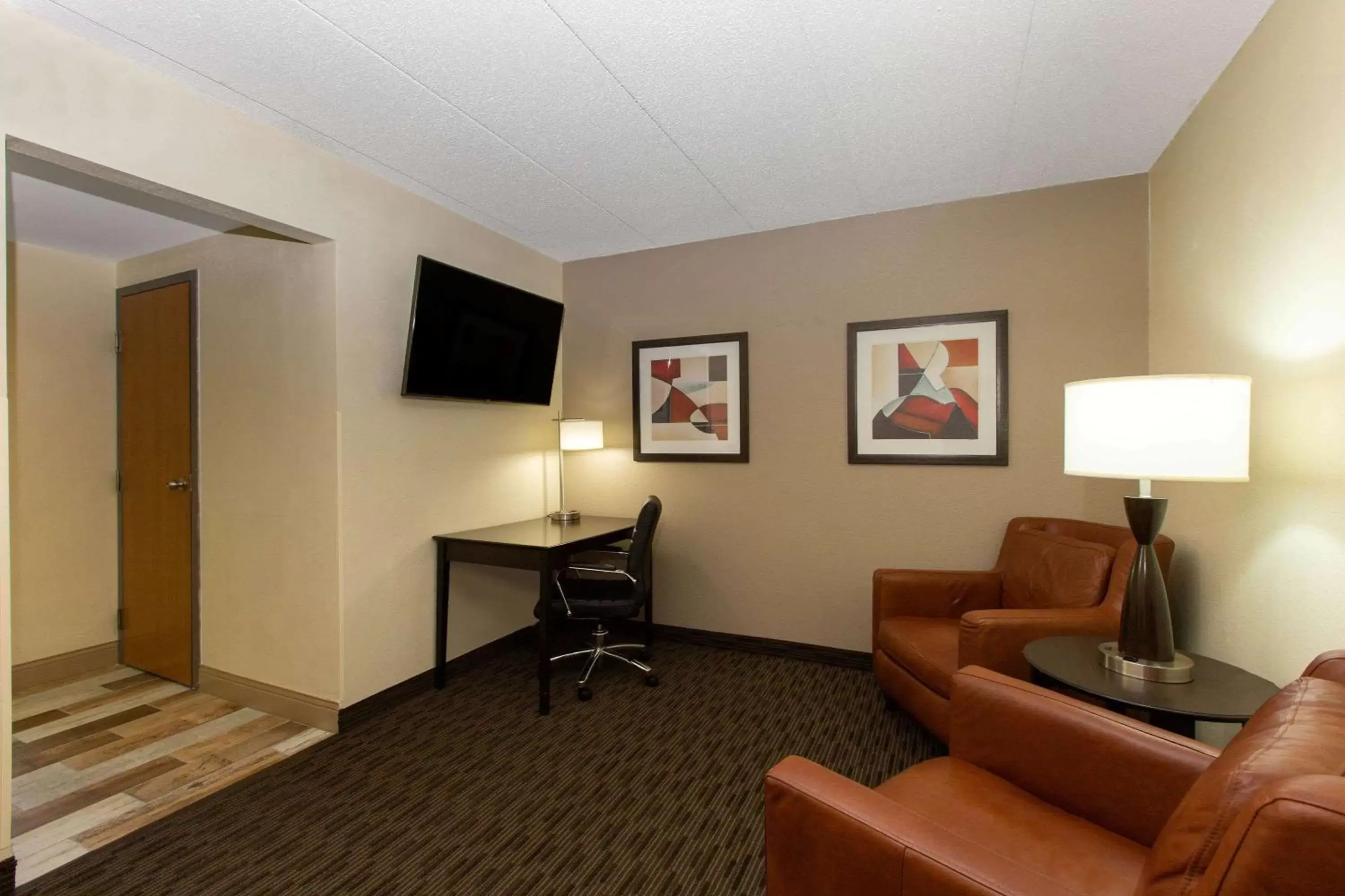 Photo of the whole room, TV/Entertainment Center in AmericInn by Wyndham Apple Valley