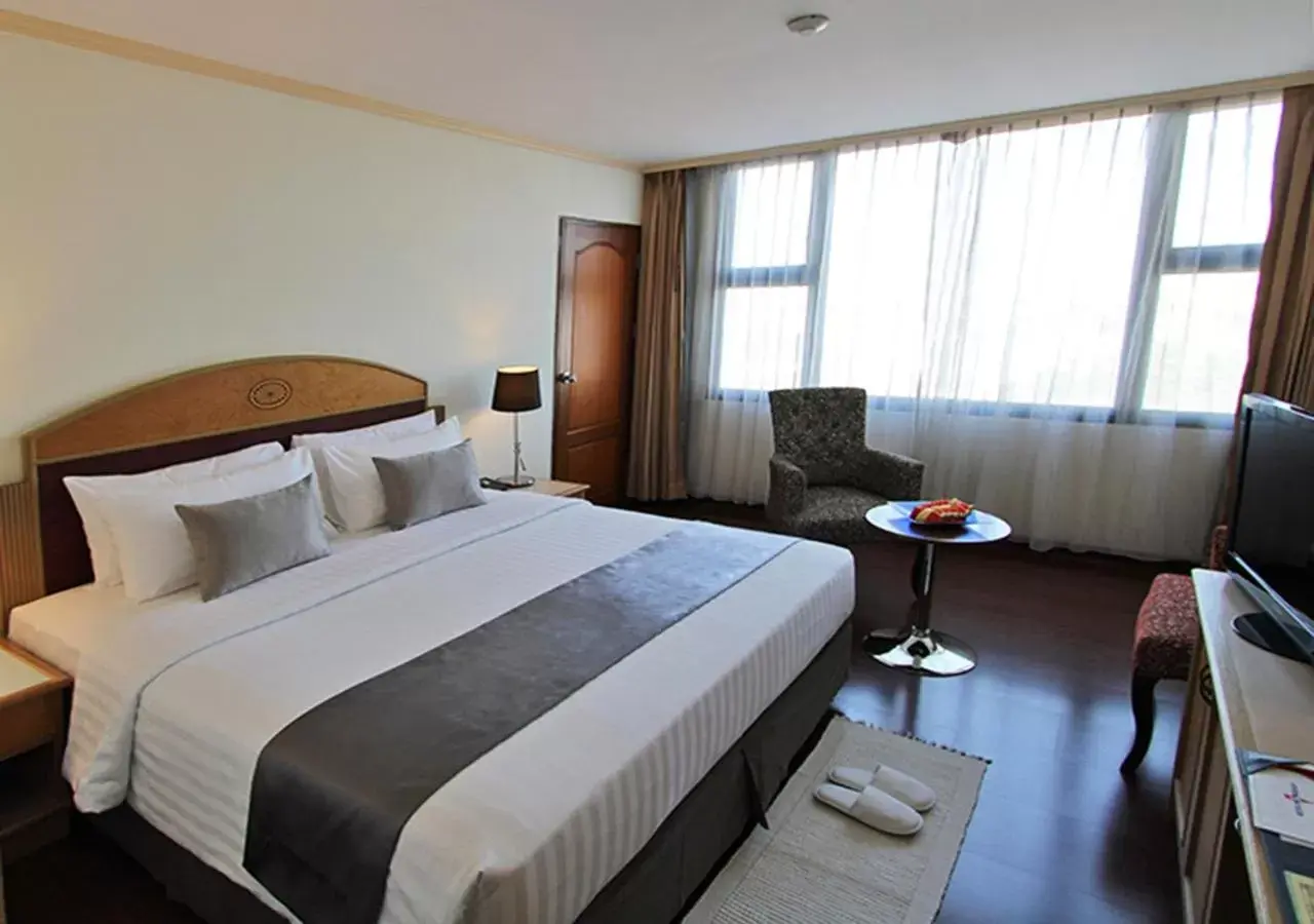 Photo of the whole room, Bed in Grand Tower Inn Rama 6 - SHA Extra Plus