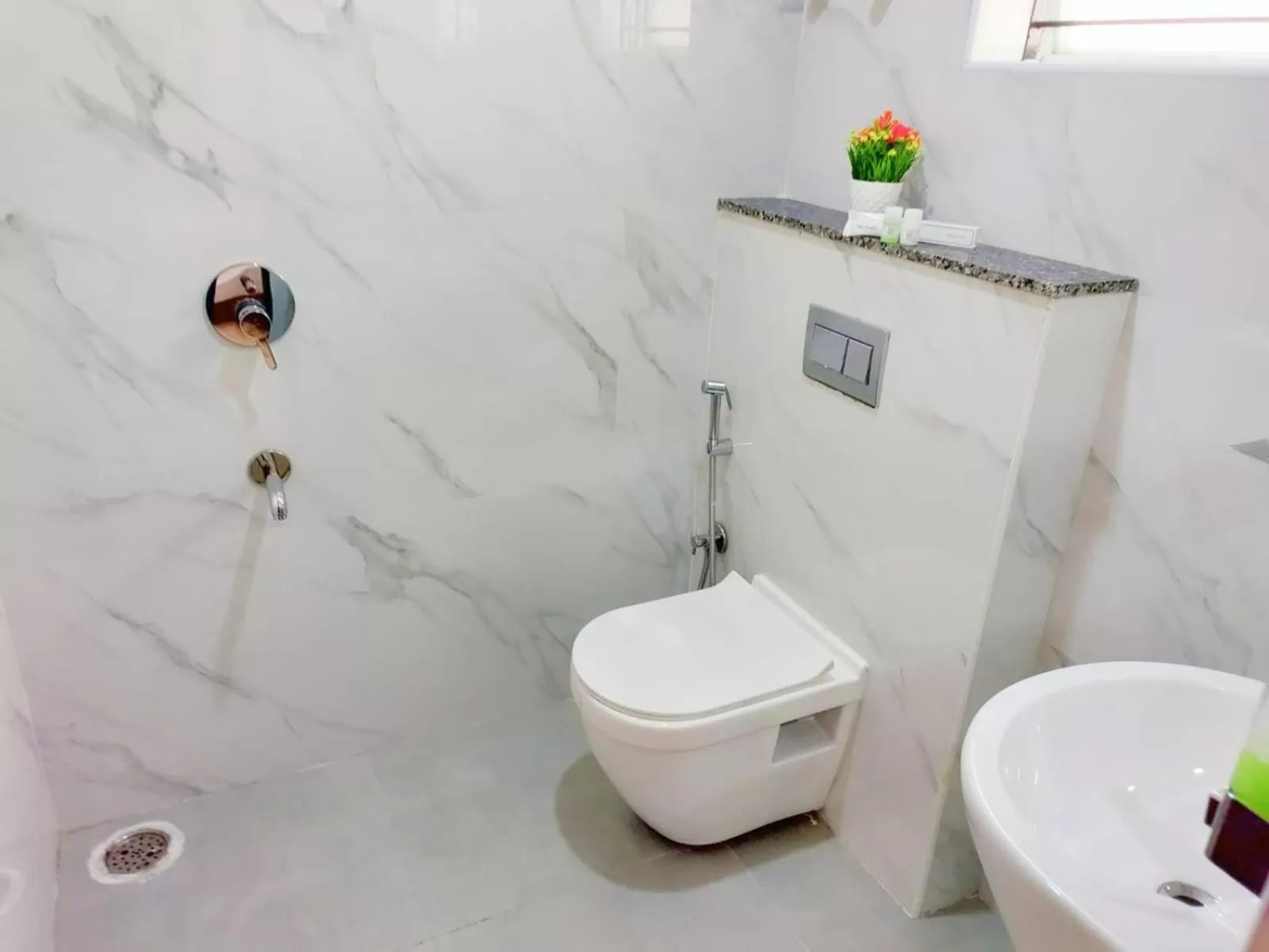 Toilet, Bathroom in Keerthis Royal Suites - Hotel Near Kempegowda International Airport