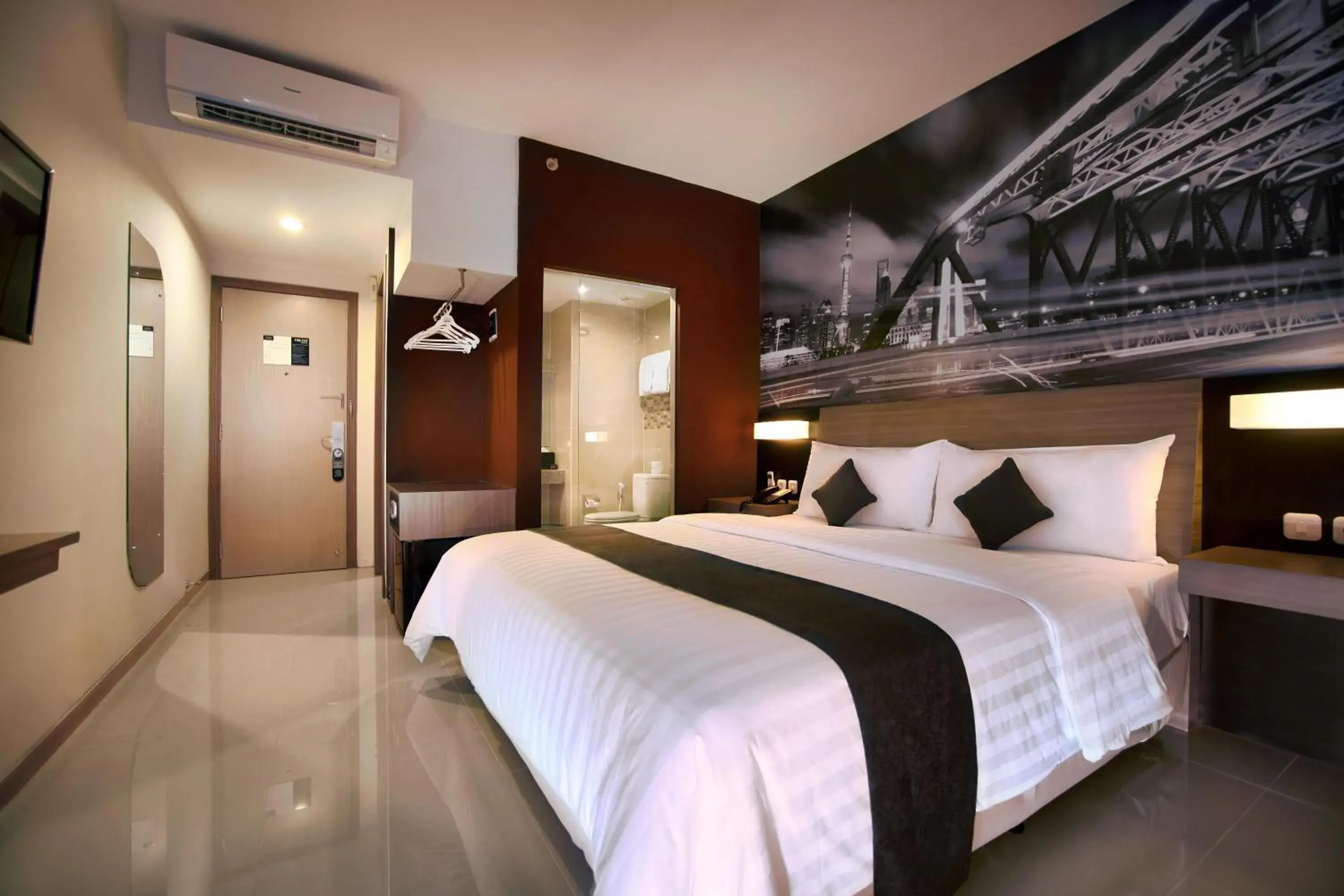 Photo of the whole room, Bed in Hotel Neo Candi Semarang