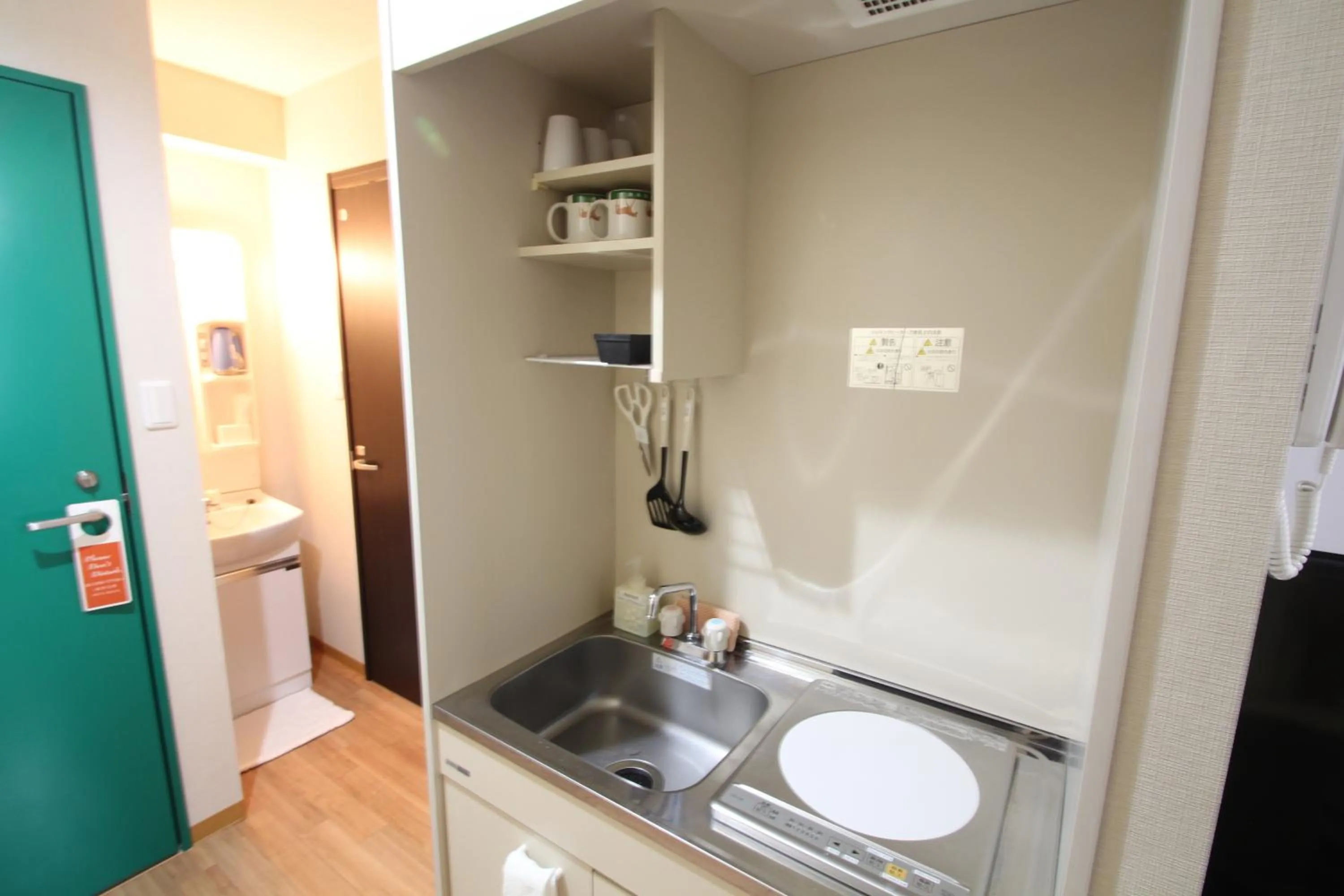 Kitchen or kitchenette in Sakura Hotel Hatagaya