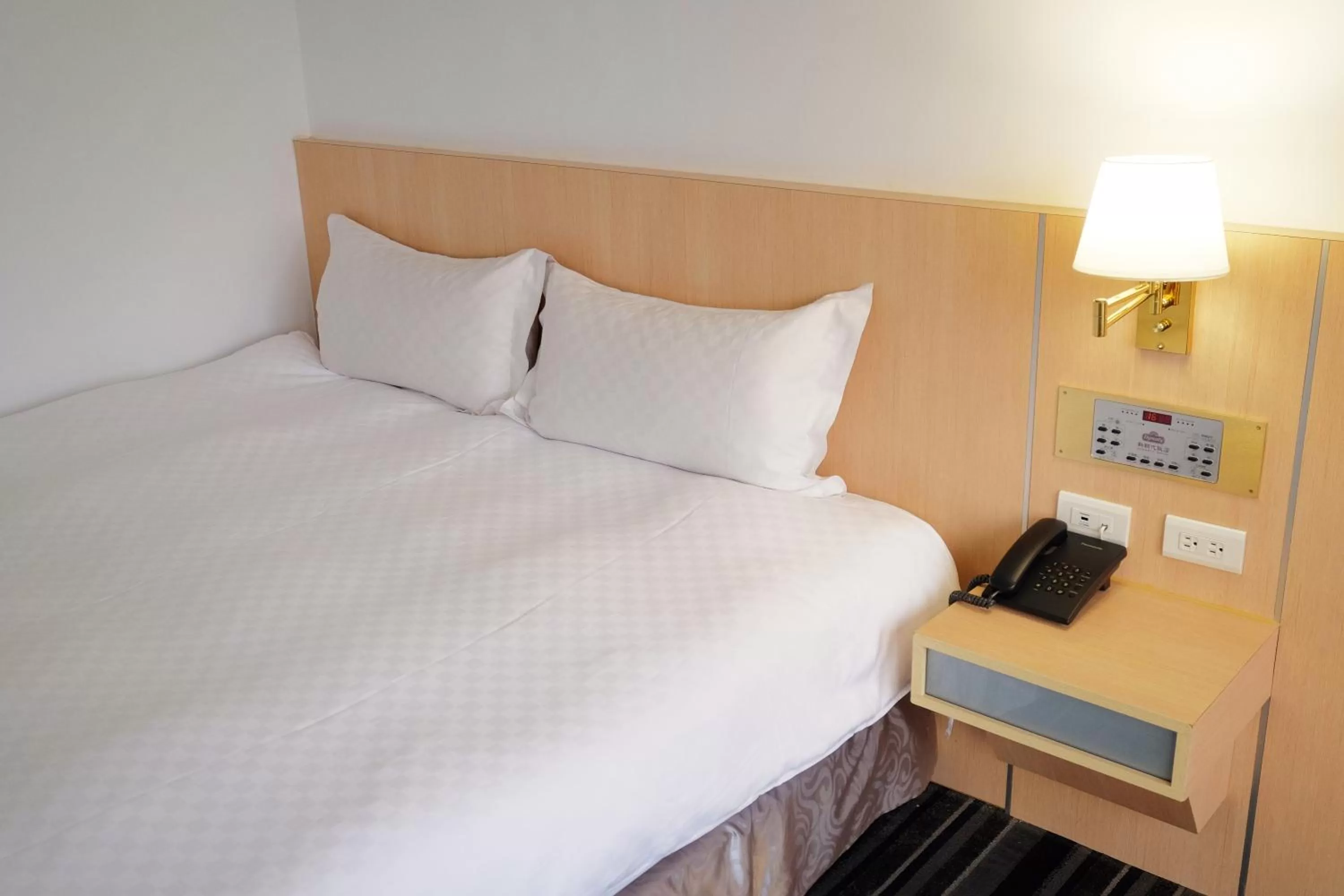 Bed in Dynasty Hotel