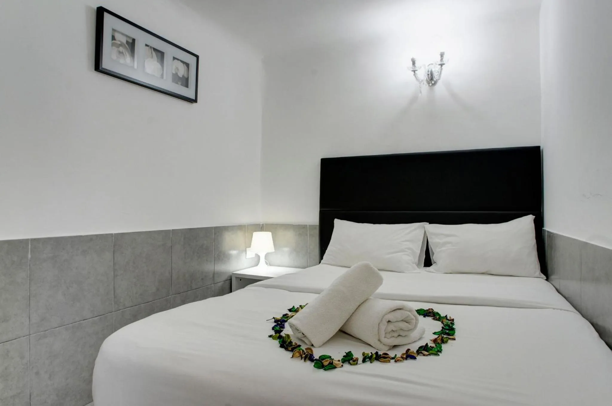 Bed in Liber Tel Aviv Sea Shore Suites BY RAPHAEL HOTELS