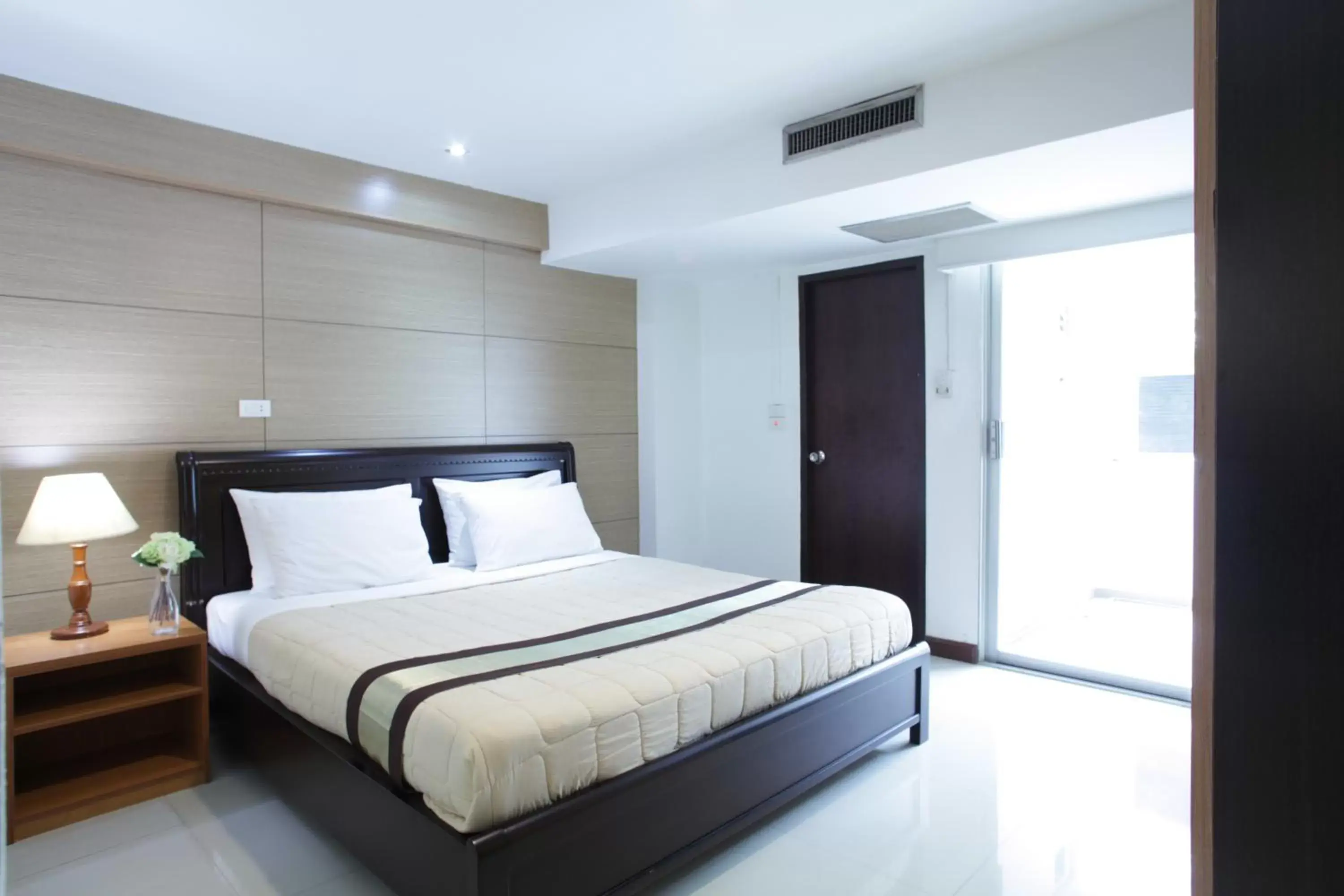Bed in Nanatai Suites