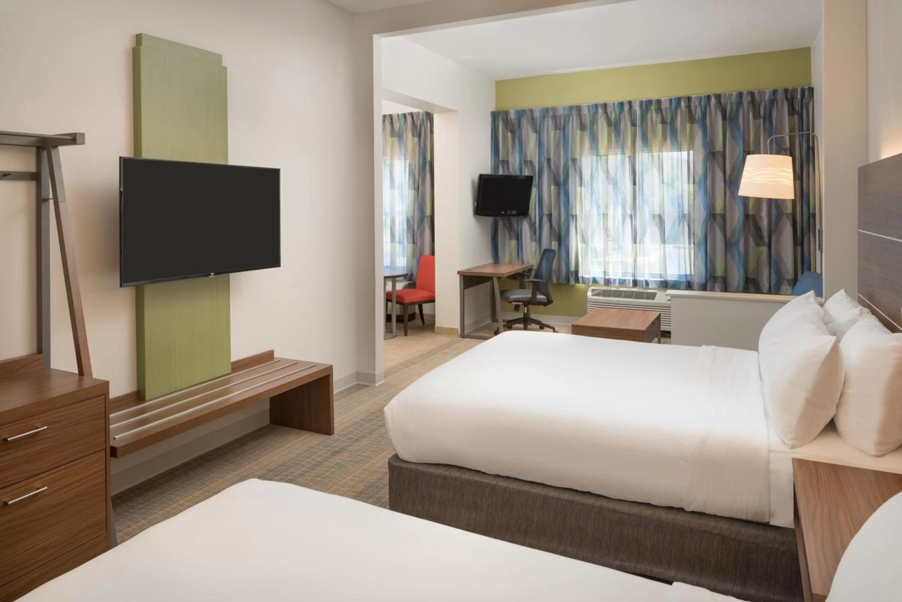 Bedroom, Bed in Holiday Inn Express & Suites Orlando International Airport by IHG