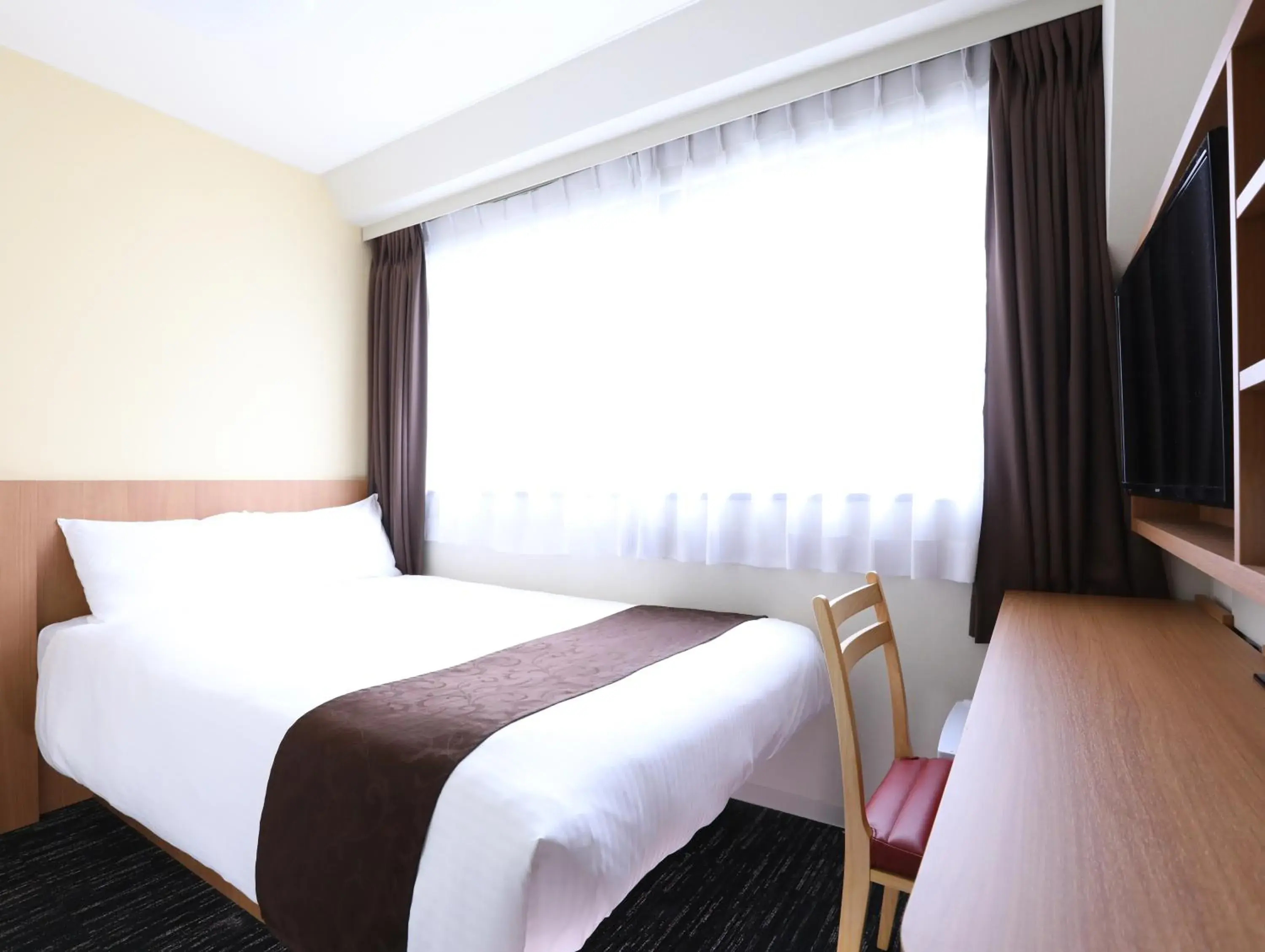 Bed in Hotel Wing International Korakuen