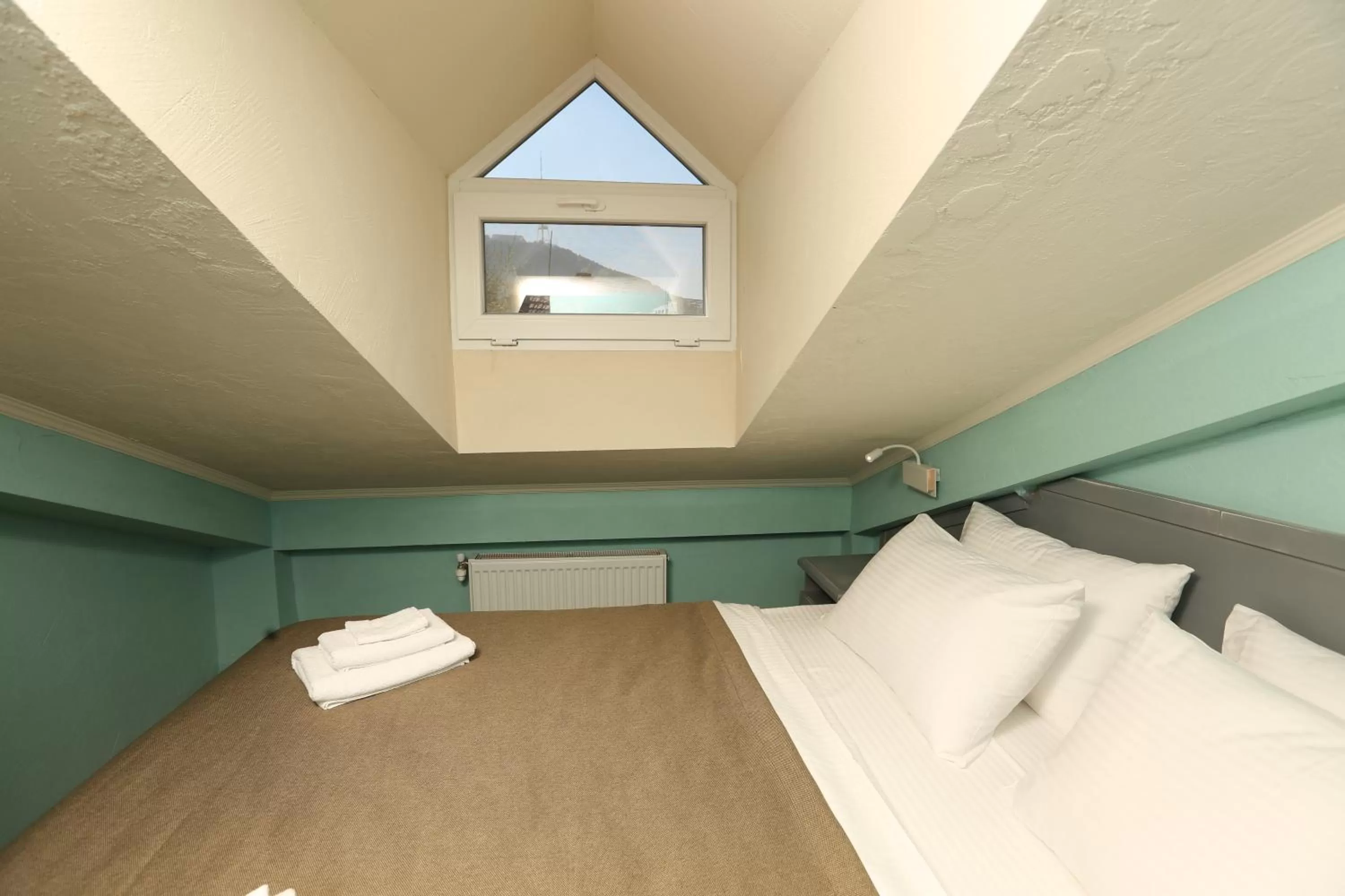 Bed in Kindli Boutique Hotel