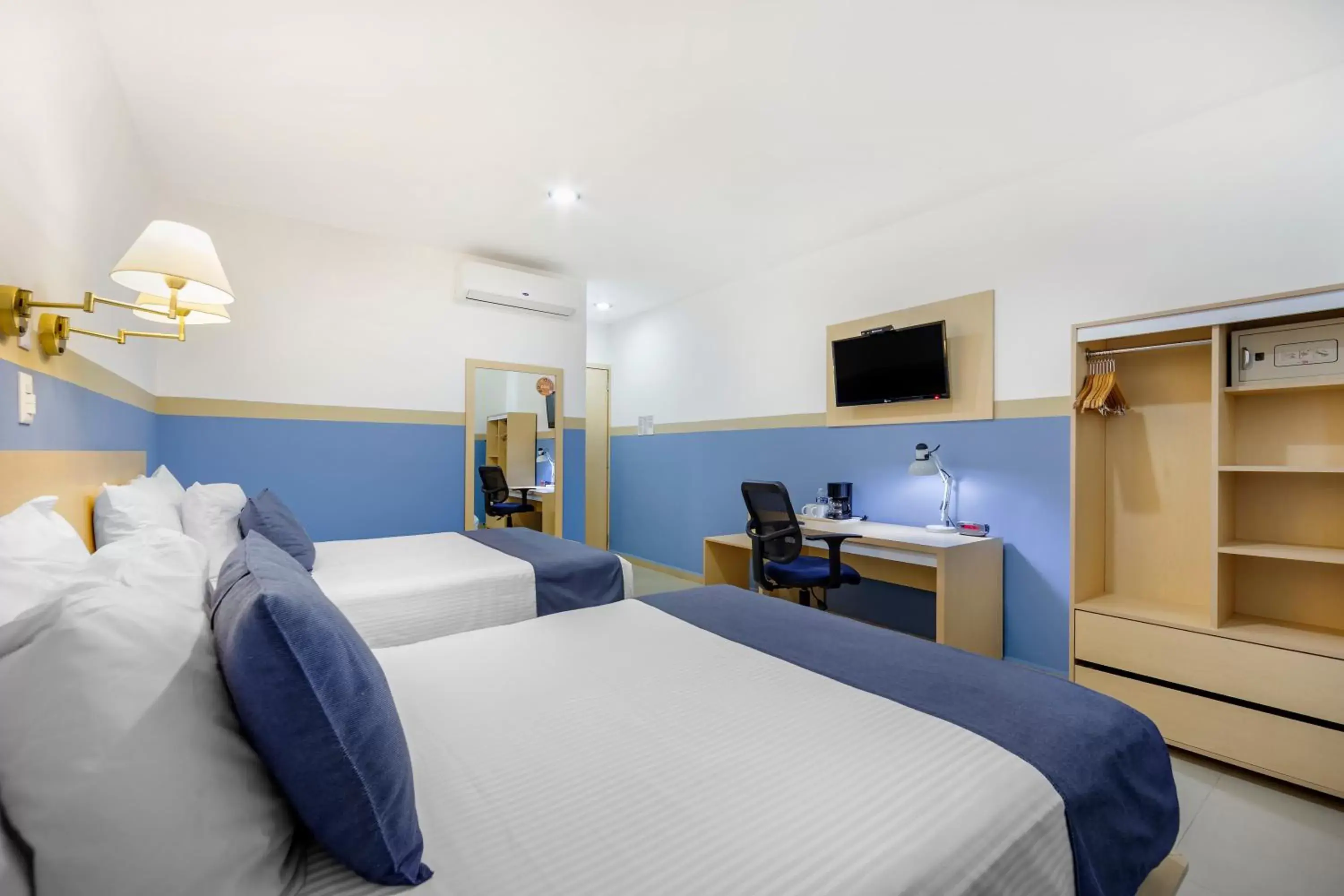 Bed in Sleep Inn Tuxtla