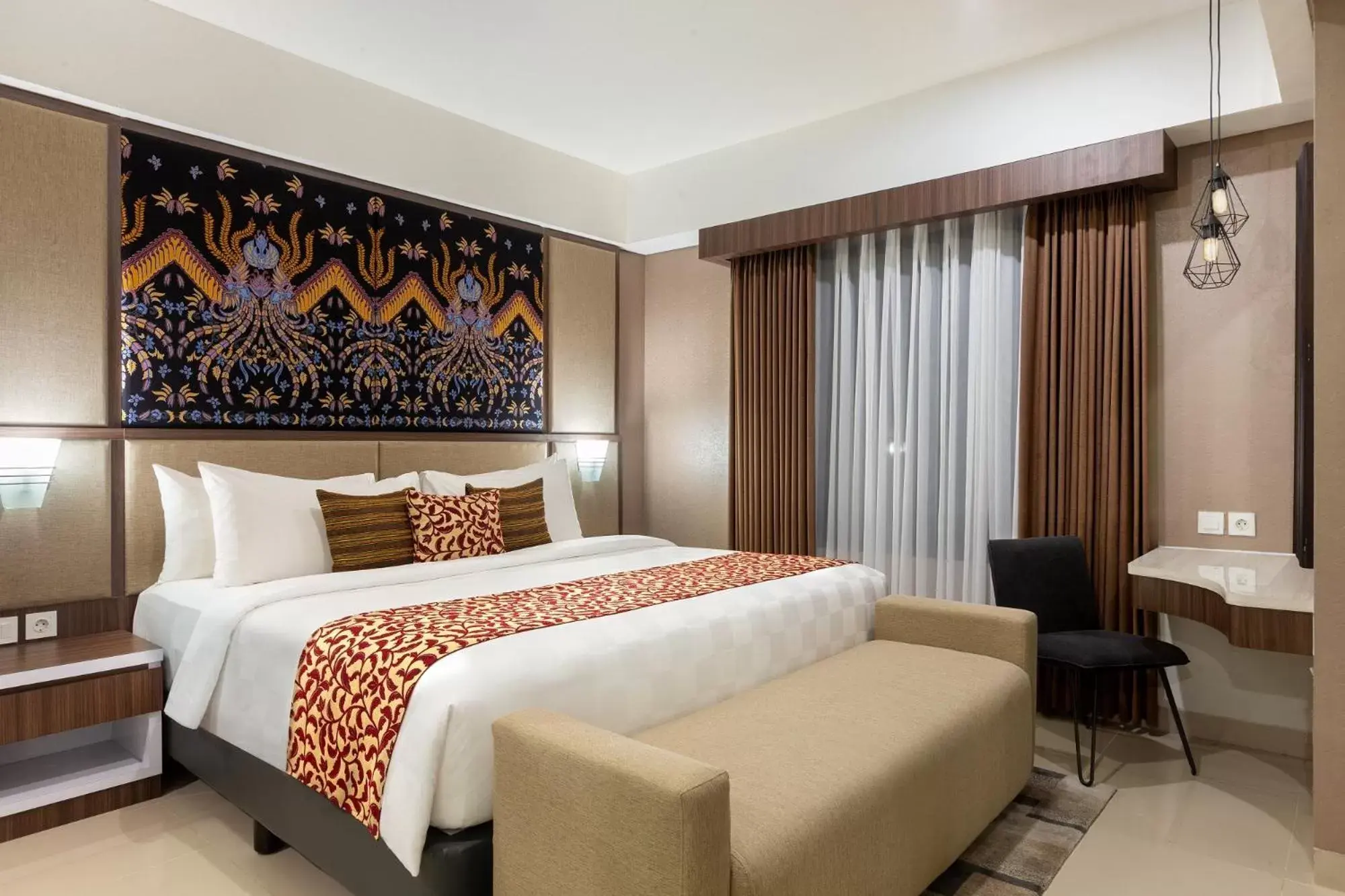 Bed in The Alana Hotel & Conference Center Malioboro Yogyakarta by ASTON