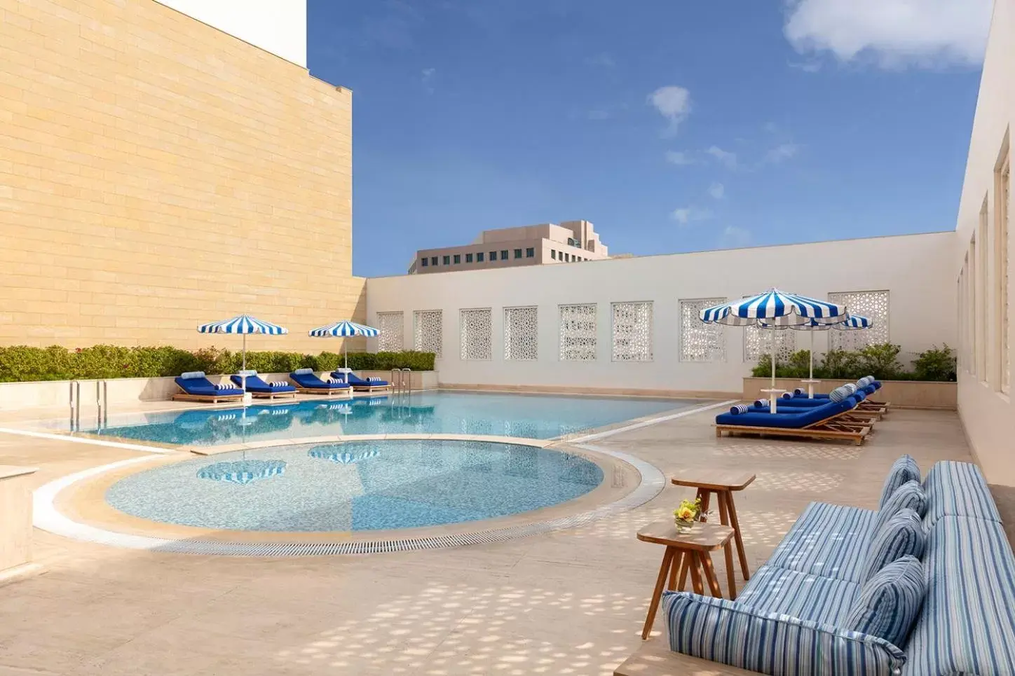 Swimming pool, Property Building in Al Najada Doha Hotel by Tivoli
