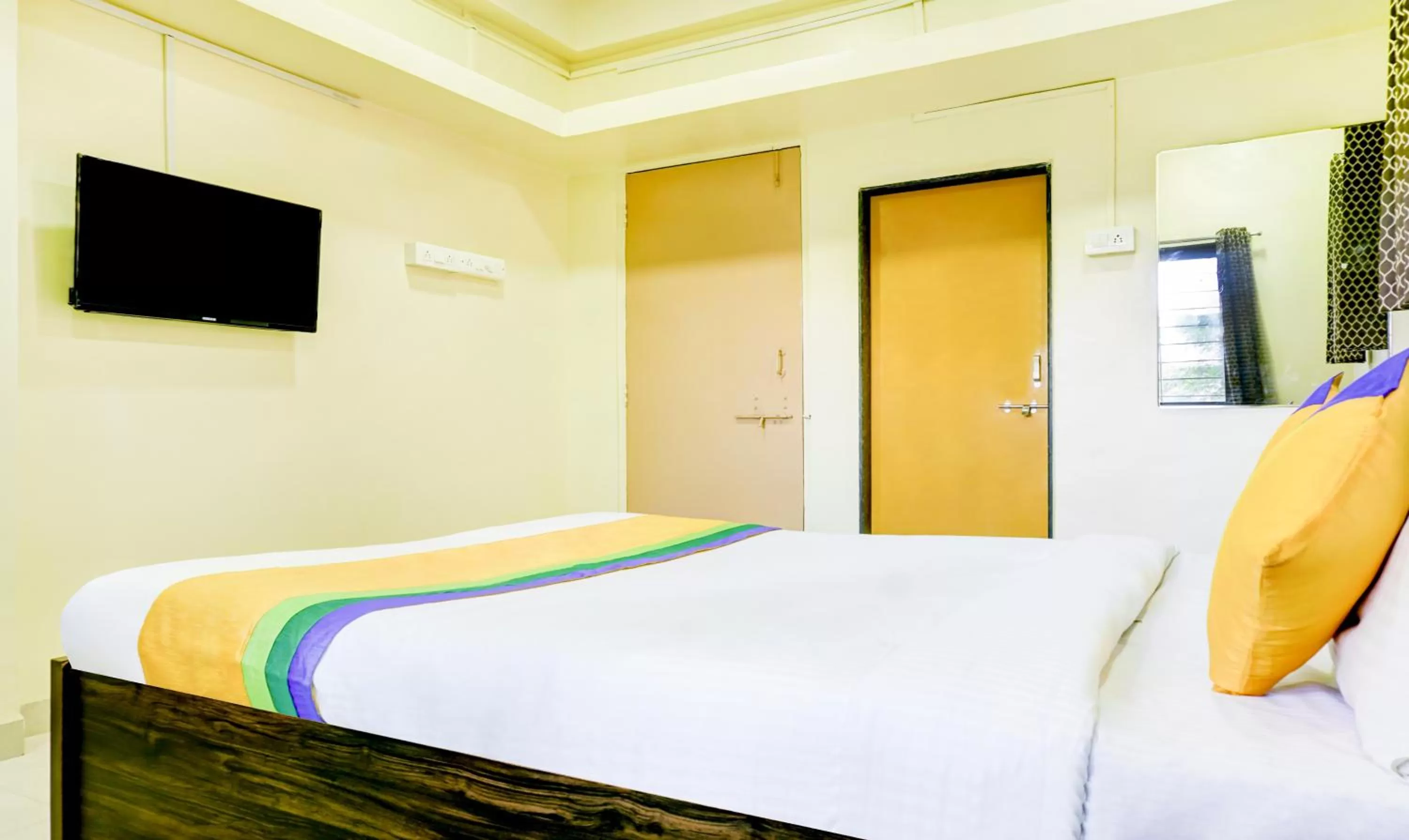 TV and multimedia, Bed in Hotel Bestow Inn Koregaon Park Pune -Near Osho Ashram