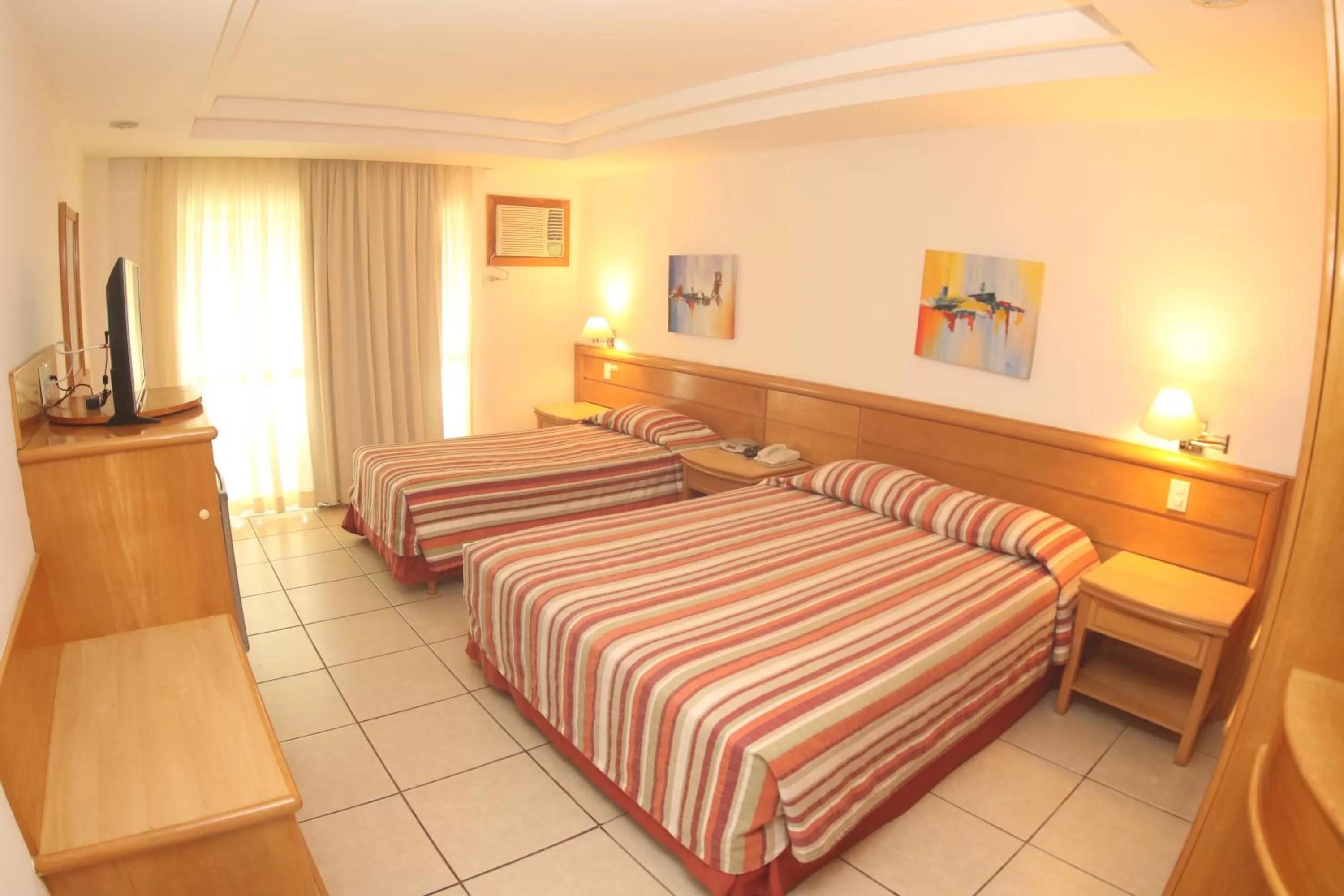 Bed in Hotel Atlântico Búzios Convention