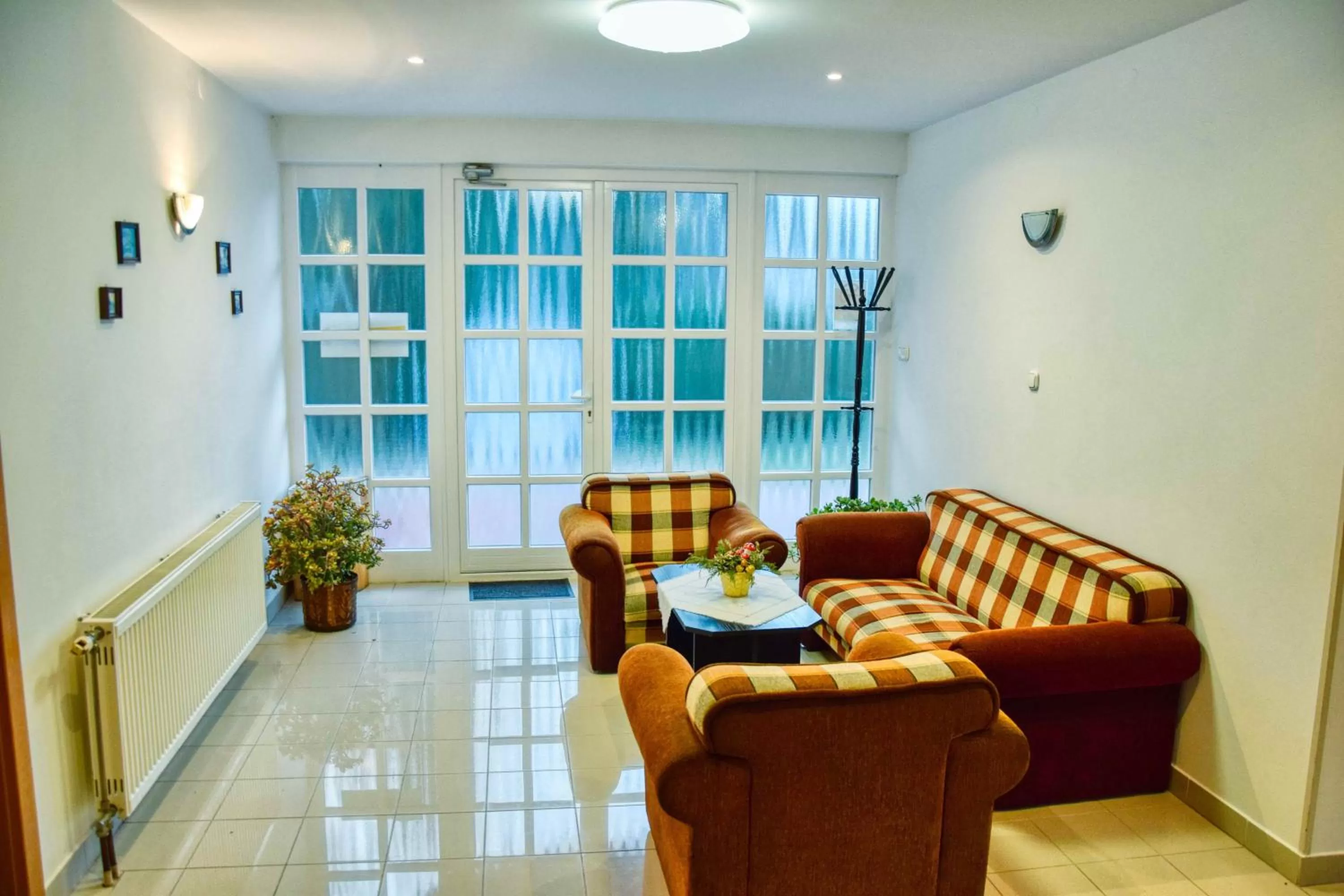 Communal lounge/ TV room in Hotel Penta Lux