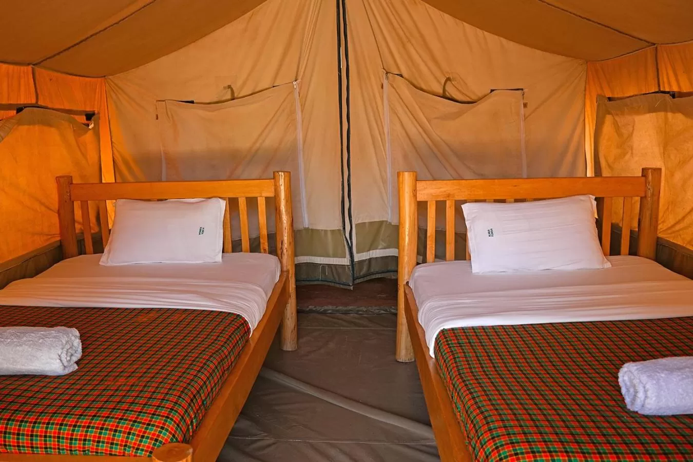 Bed in Kara-Tunga Safari Camp