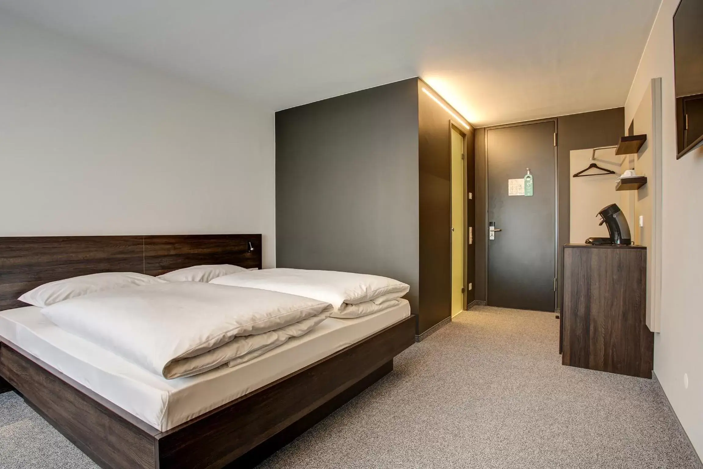 Photo of the whole room, Bed in Centro Parkhotel Stuttgart
