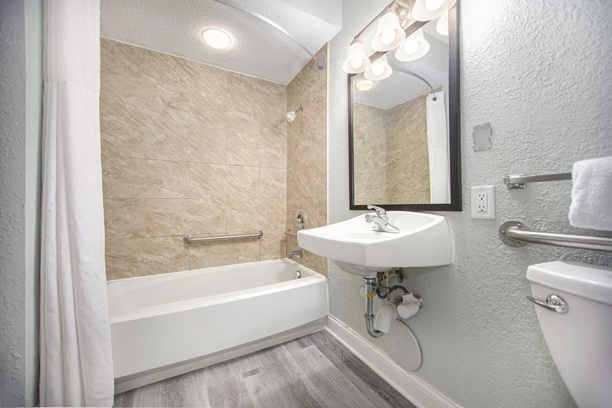 Bathroom in Baymont by Wyndham Grand Haven