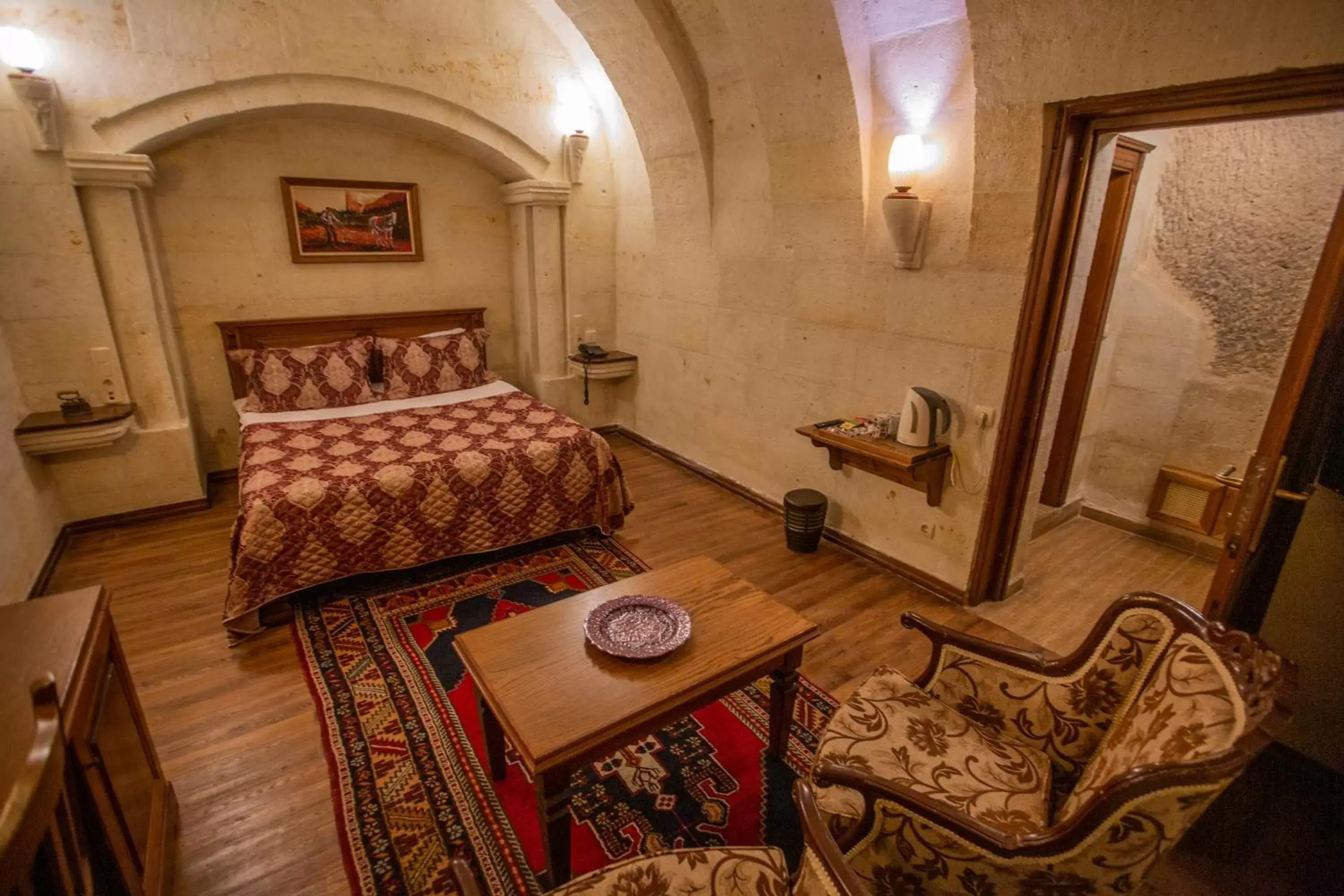 Photo of the whole room, Bed in Stone House Cave Hotel