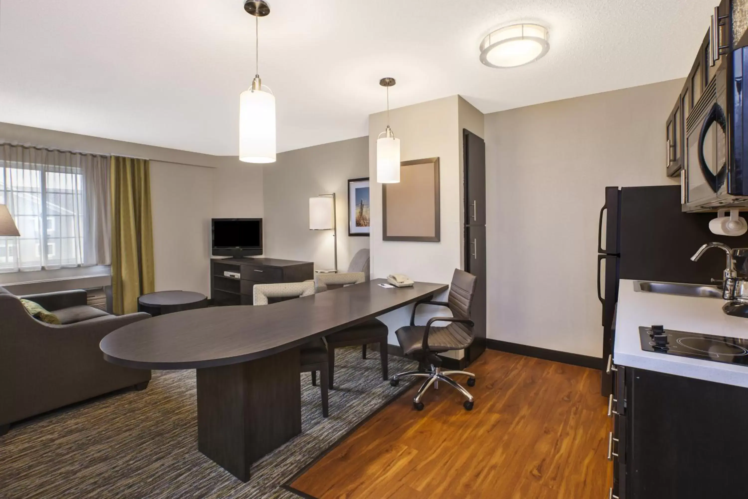 Photo of the whole room, Kitchen/Kitchenette in Candlewood Suites Indianapolis Northeast, an IHG Hotel