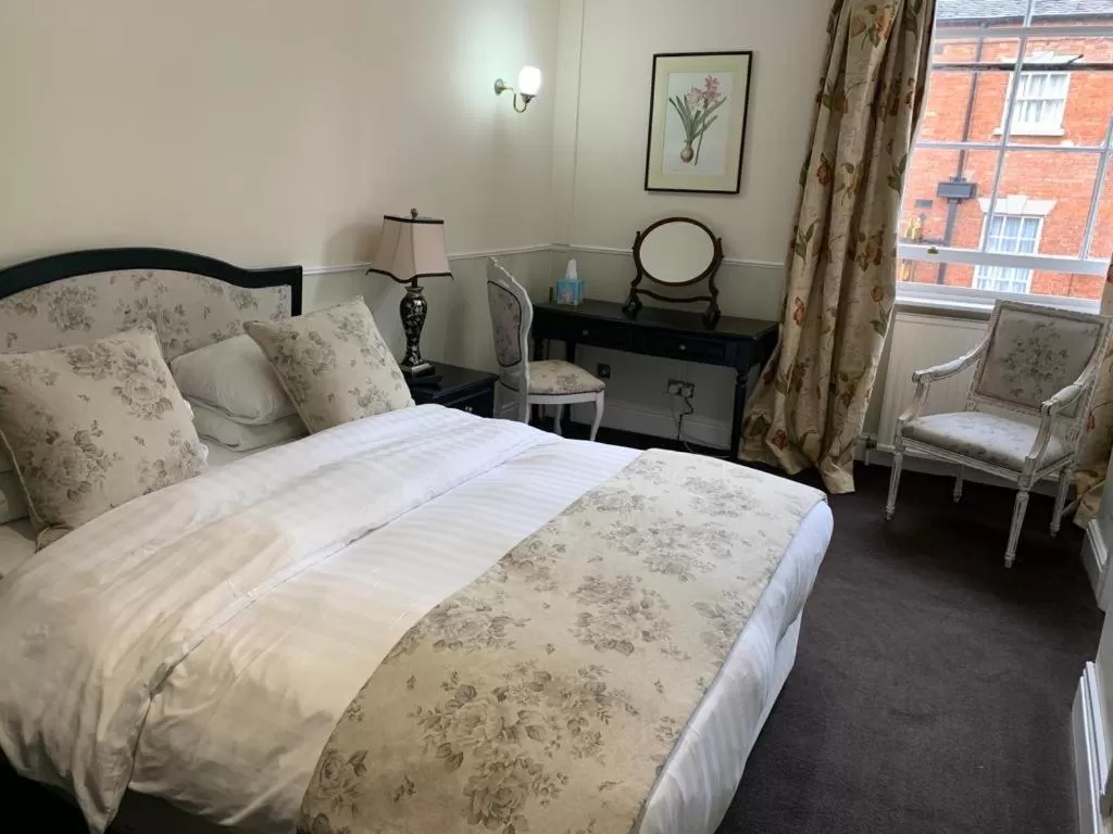 Bed in The Saracens Head Hotel