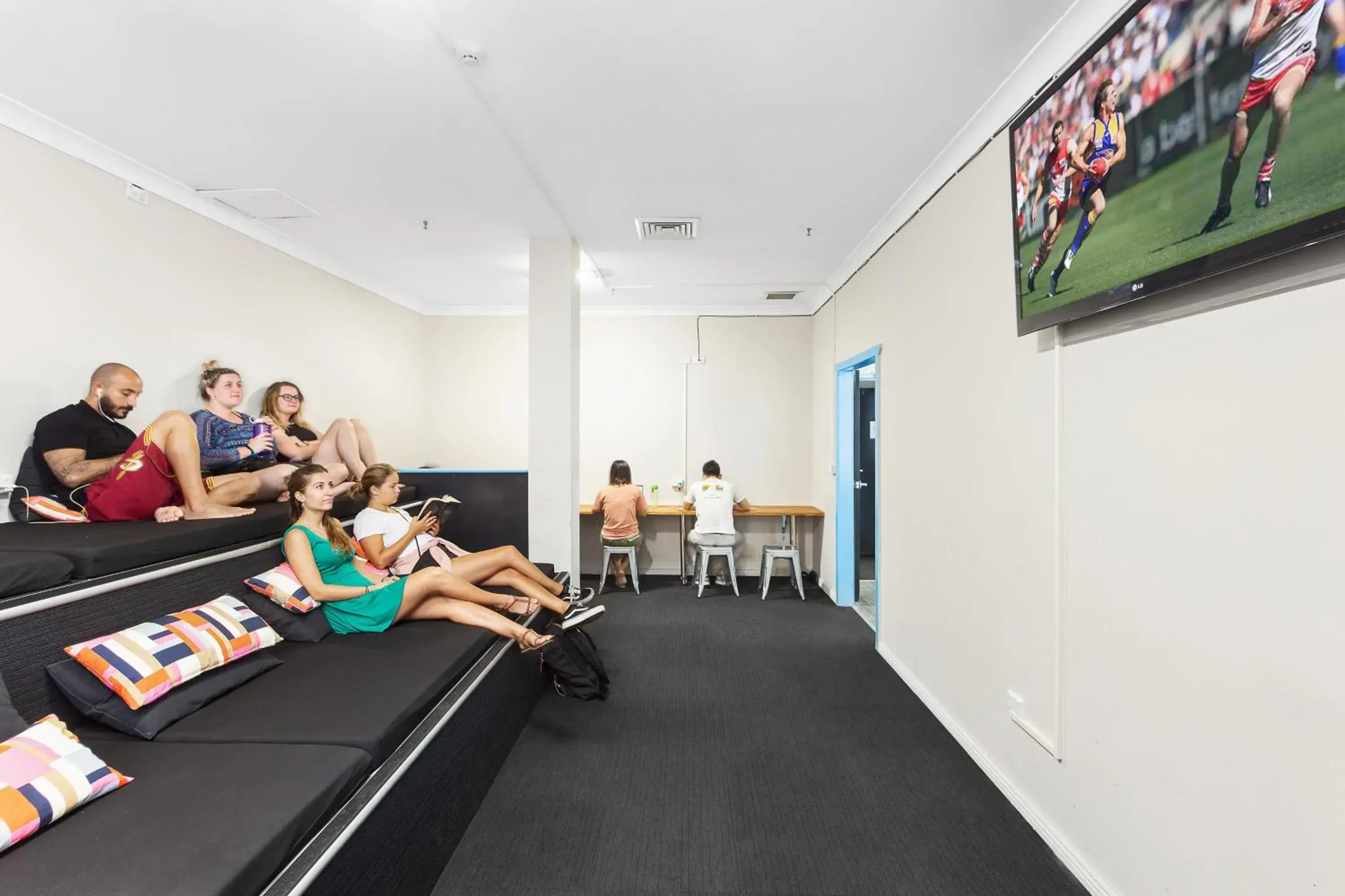 Communal lounge/ TV room in Sydney Backpackers