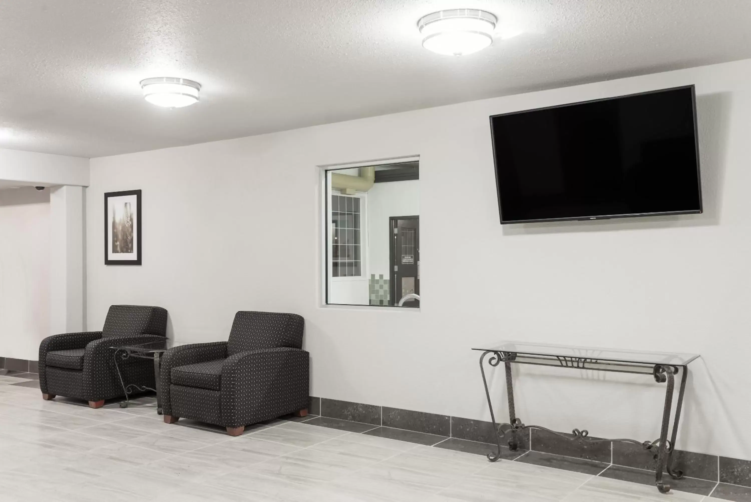 Lobby or reception in Super 8 by Wyndham Grande Prairie Lobby or reception in Super 8 by Wyndham Grande Prairie