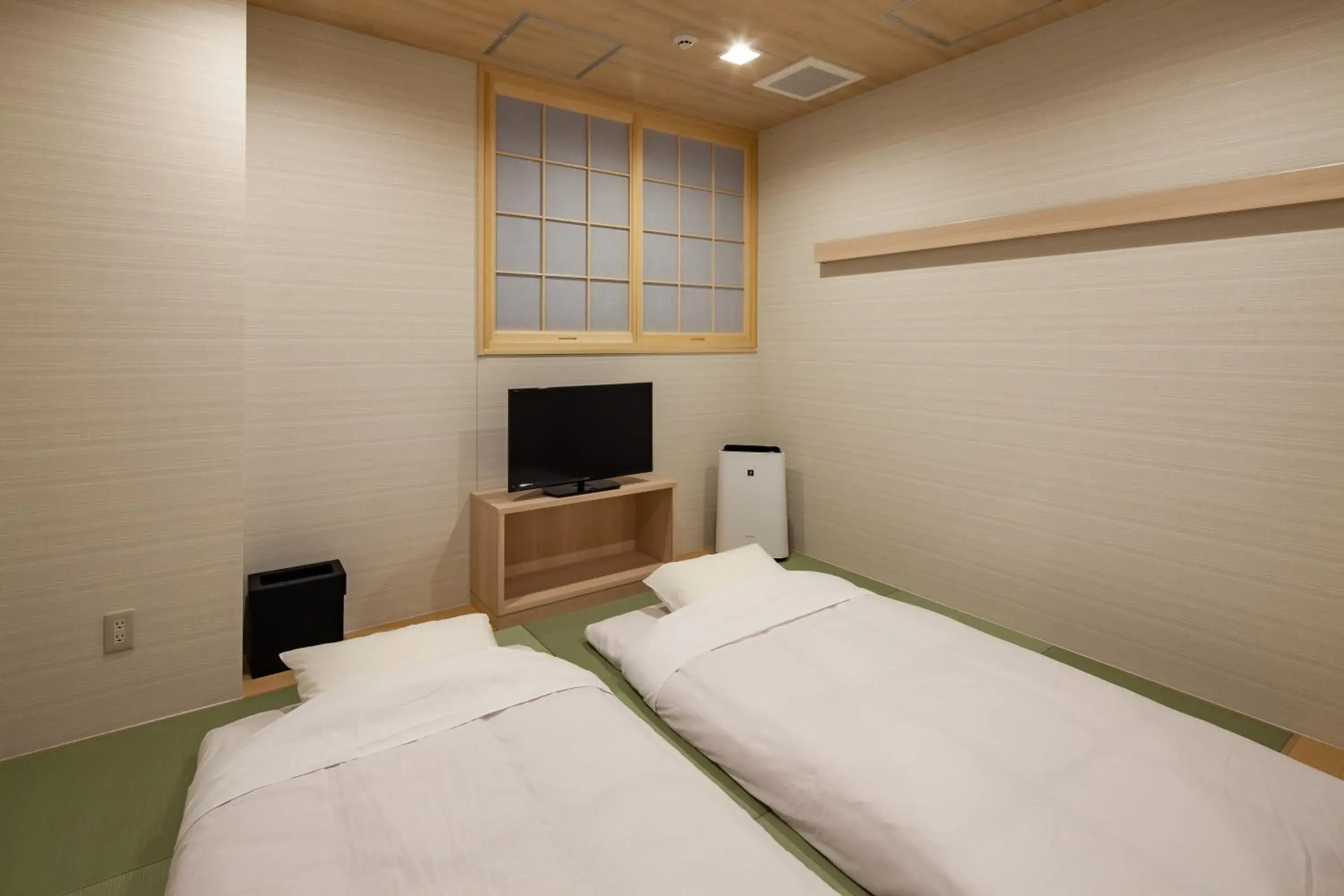 Photo of the whole room, Bed in Y's CABIN&HOTEL Naha Kokusai Street