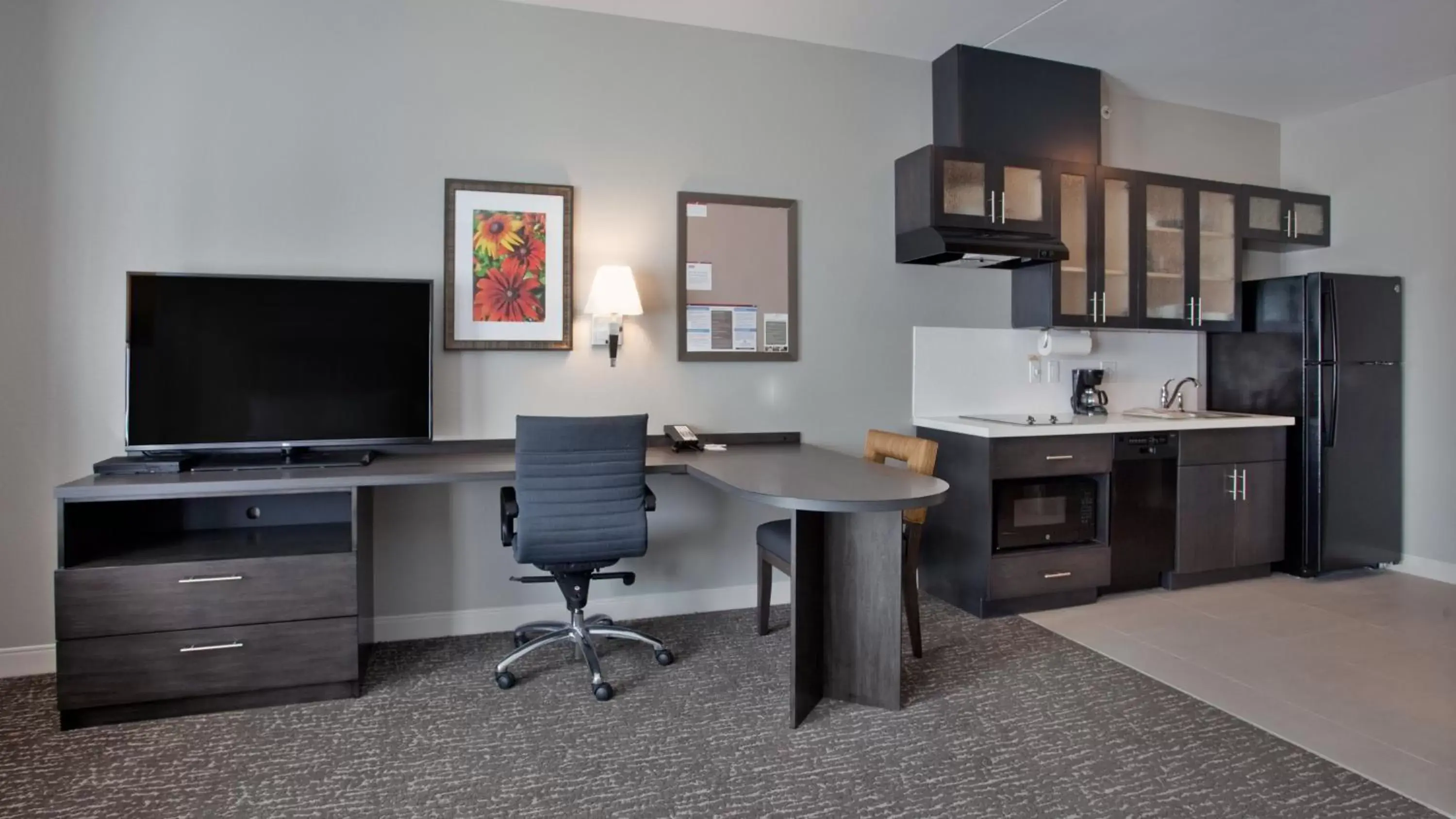 Photo of the whole room, TV/Entertainment Center in Candlewood Suites Grand Island, an IHG Hotel