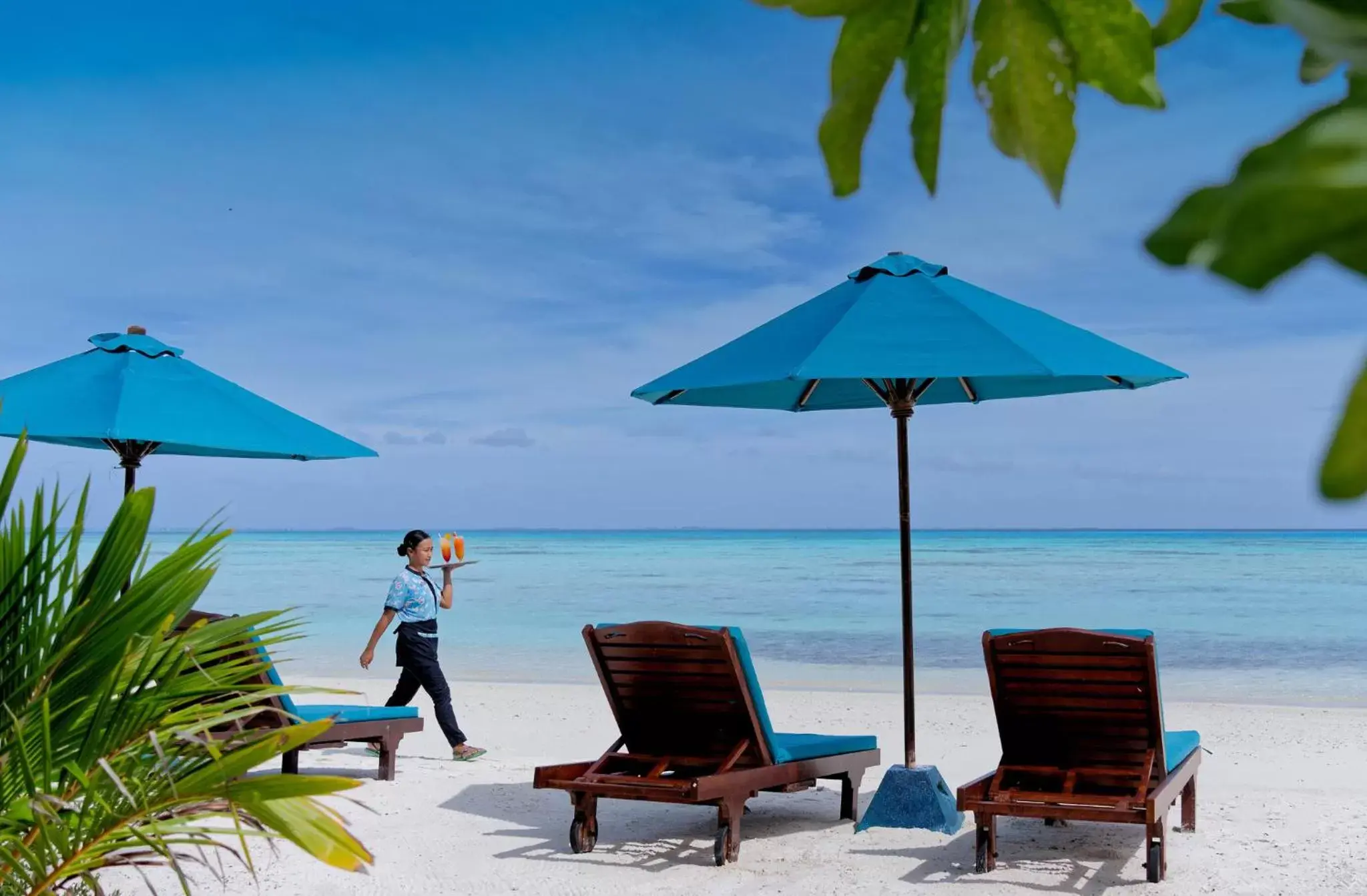Staff, Beach in Canareef Resort Maldives