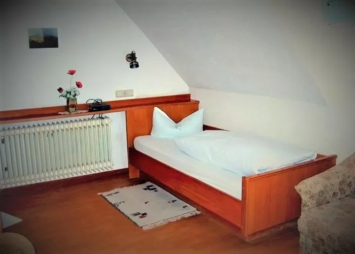 Photo of the whole room, Bed in ZUR TRAUBE Schwarzwaldhotel & Restaurant am Titisee