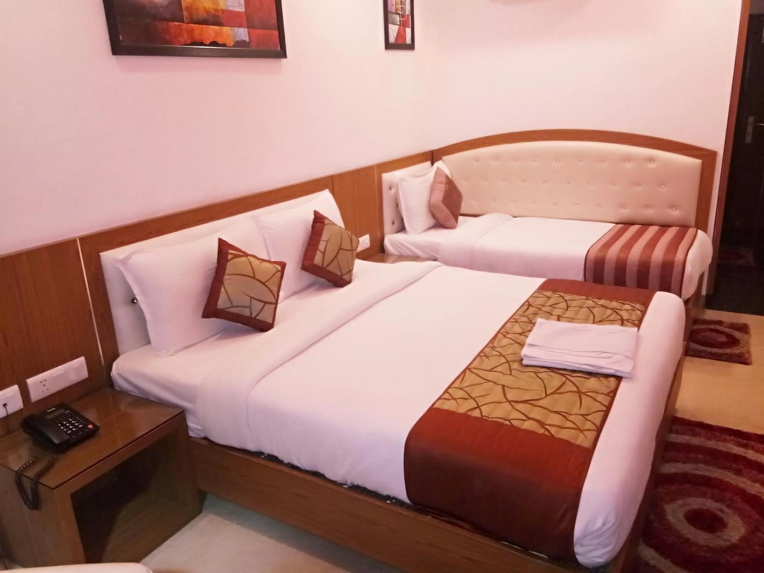 Bed in Hotel Suktara International