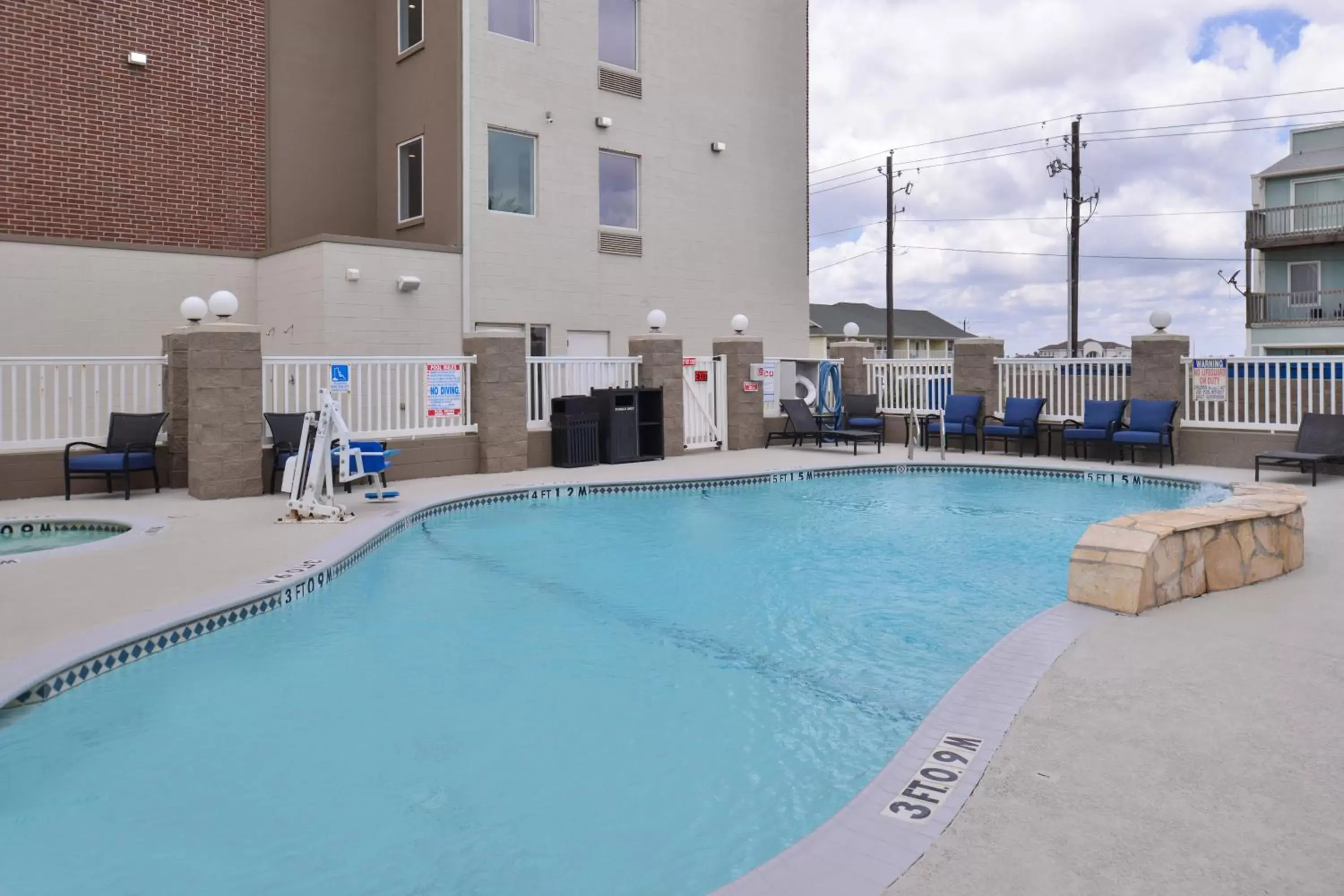 Swimming Pool in Holiday Inn Express & Suites Corpus Christi-N Padre Island, an IHG Hotel