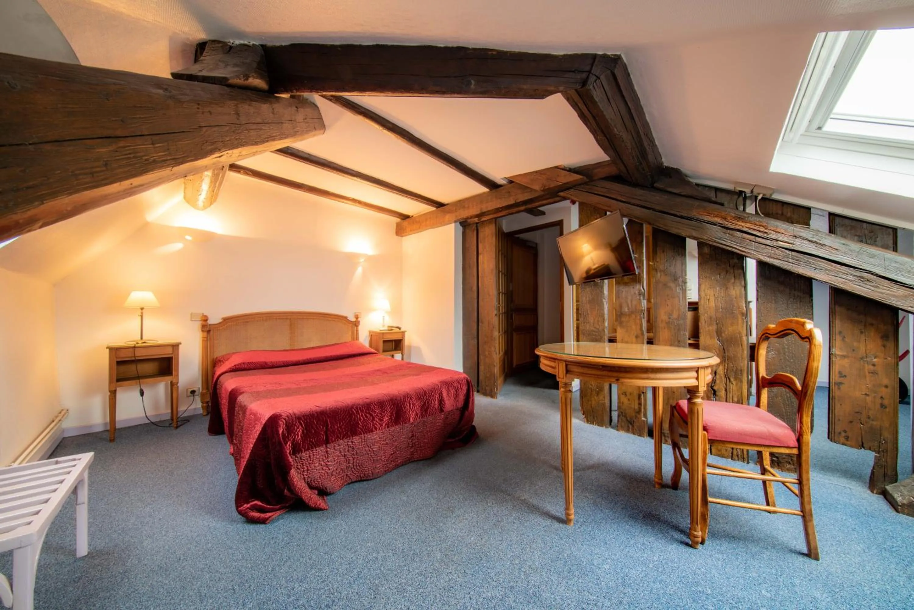 Bedroom in Hôtel du Centre