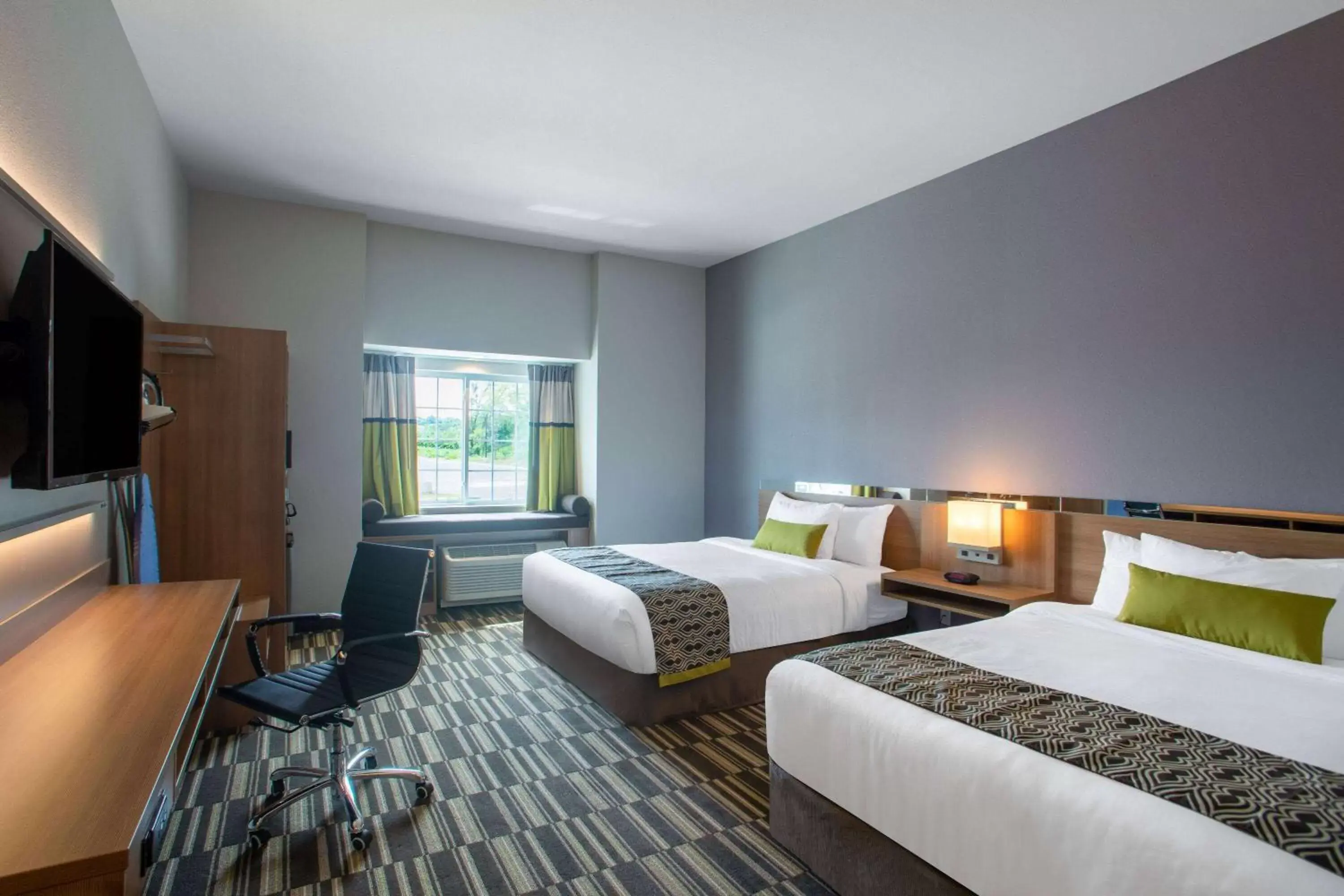 Photo of the whole room in Microtel Inn & Suites by Wyndham Liberty NE Kansas City Area