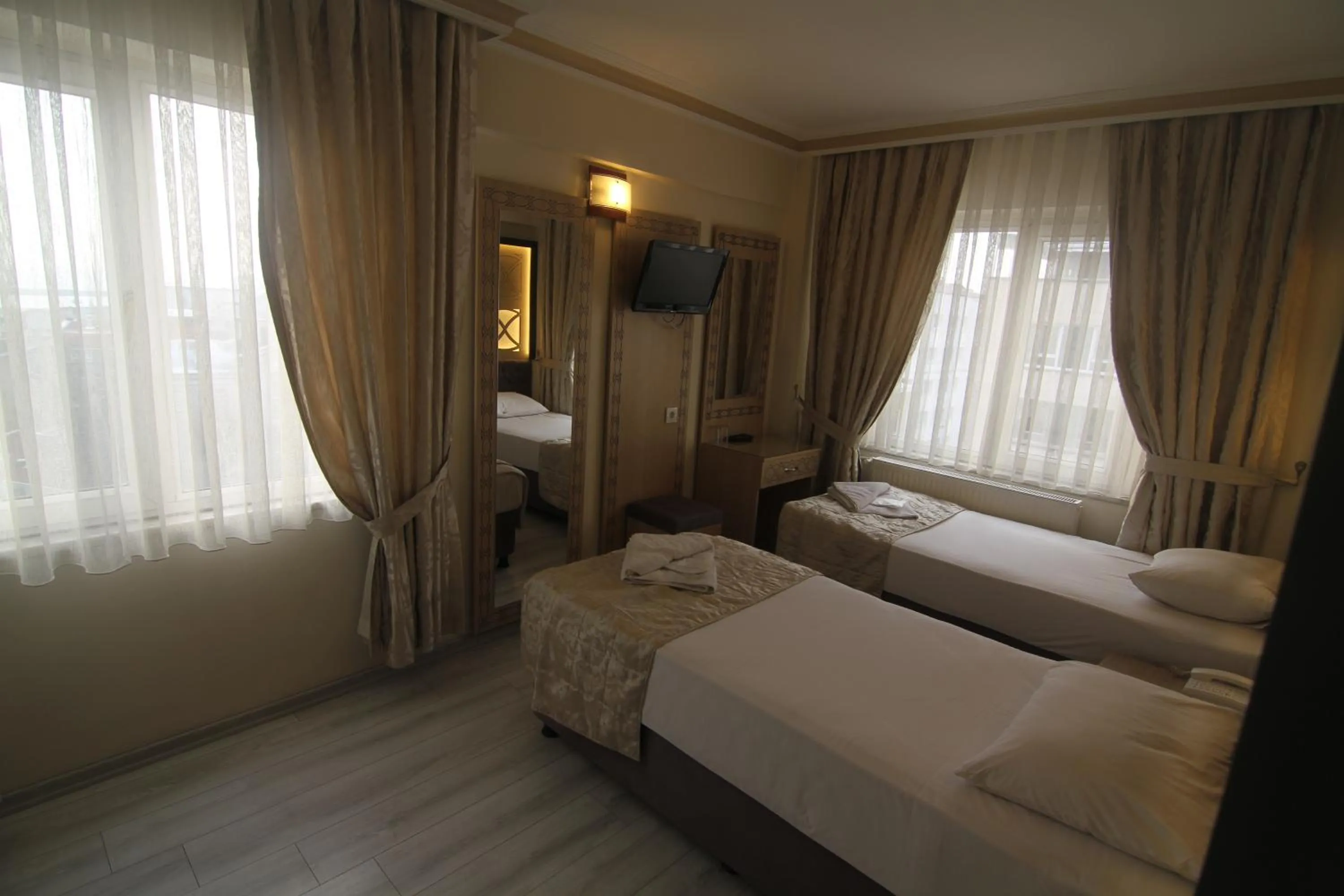 Bed in Grand Liza Hotel