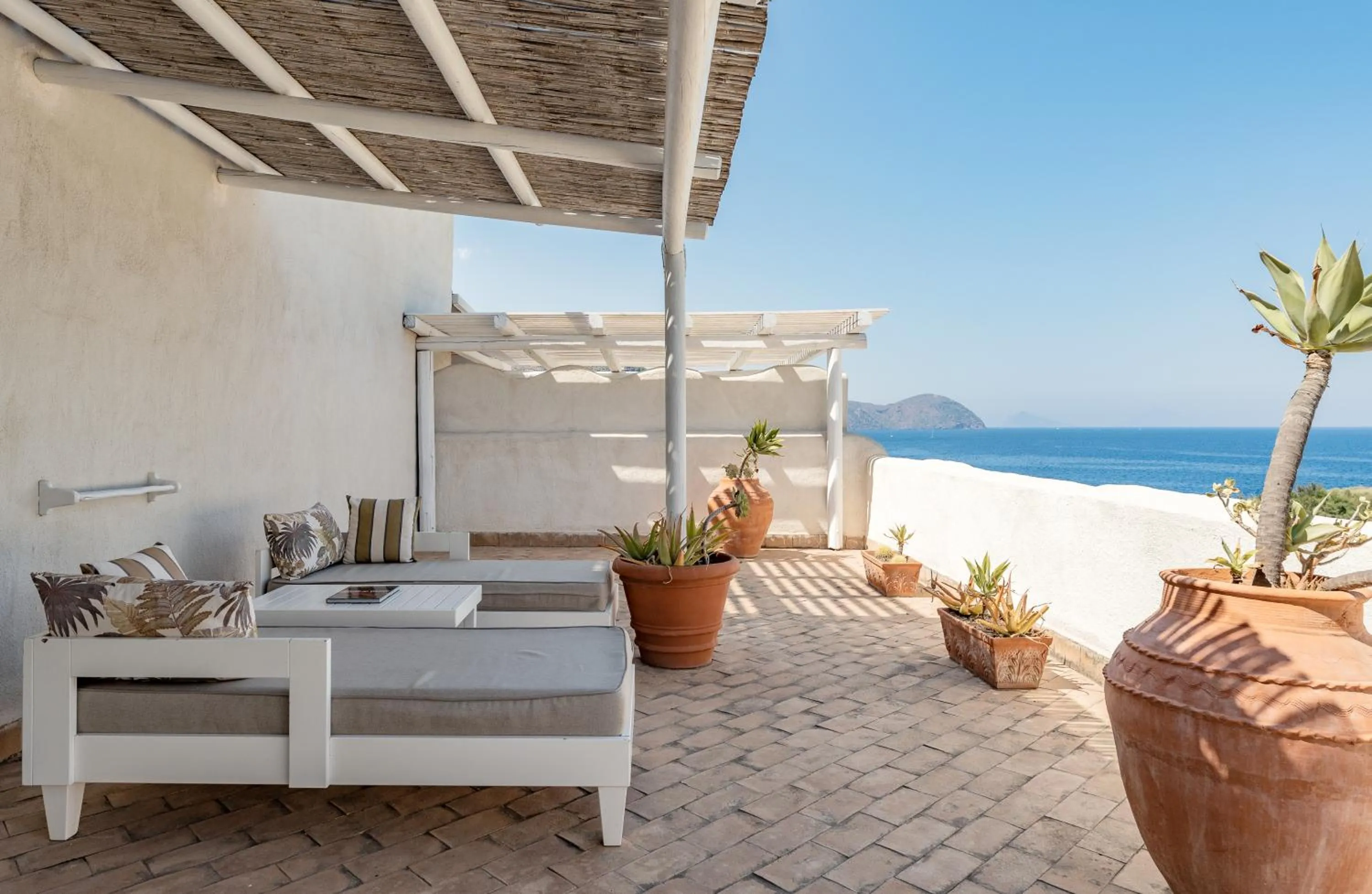 Patio in Therasia Resort Sea and SPA - The Leading Hotels of the World