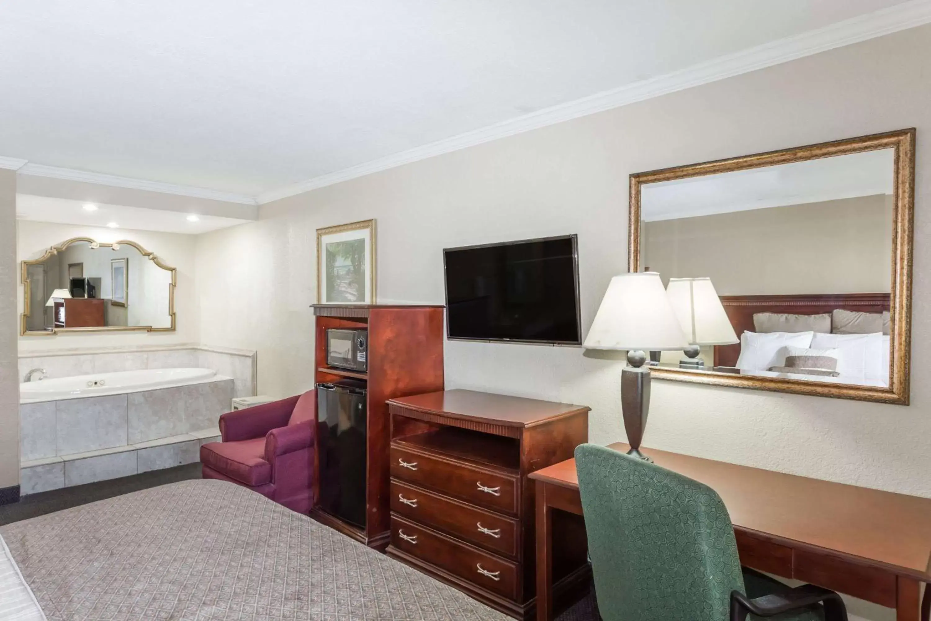 Photo of the whole room, TV/Entertainment Center in Days Inn by Wyndham Destin