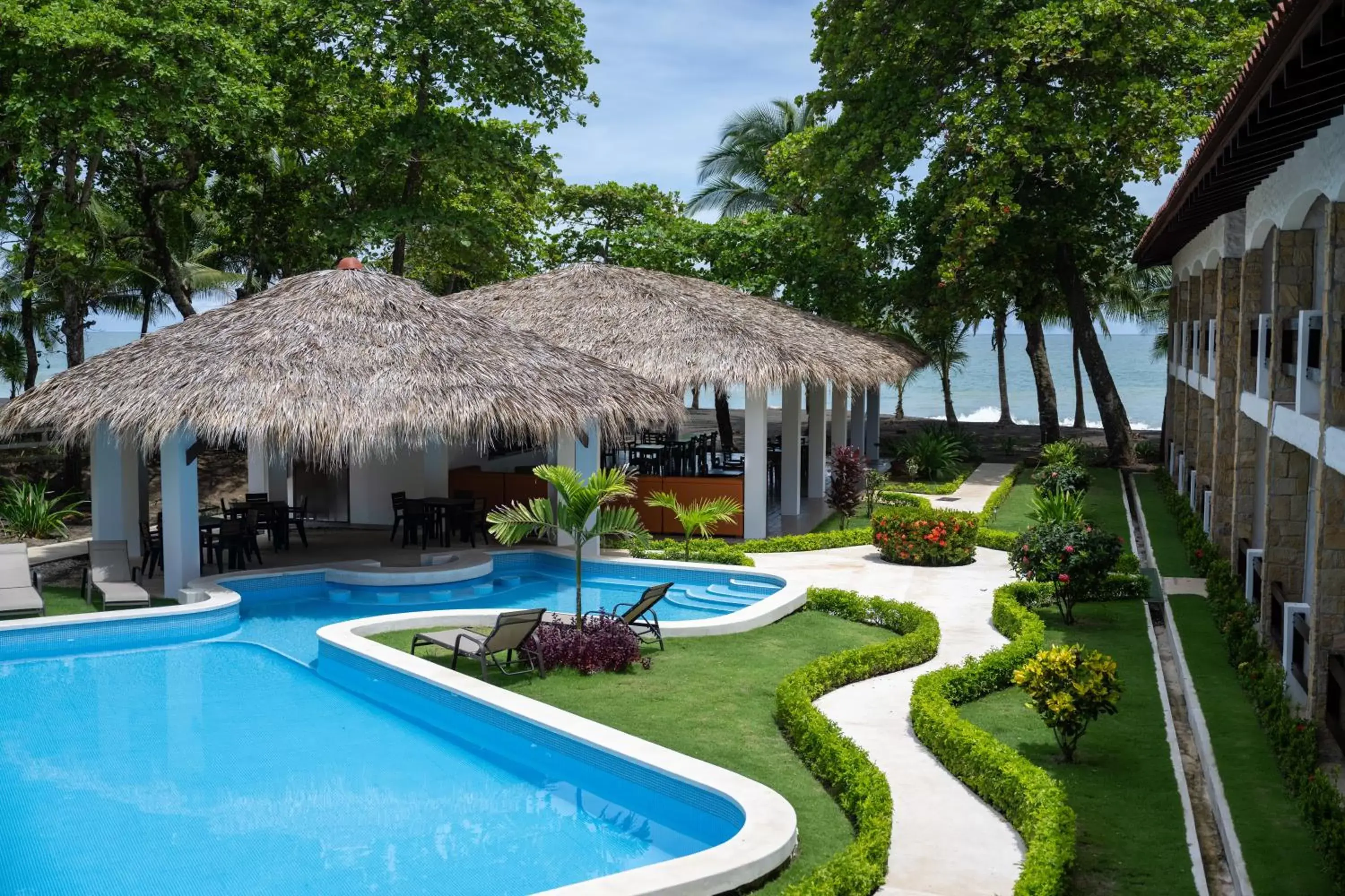 Garden view, Swimming Pool in Fuego del Sol Beachfront Hotel