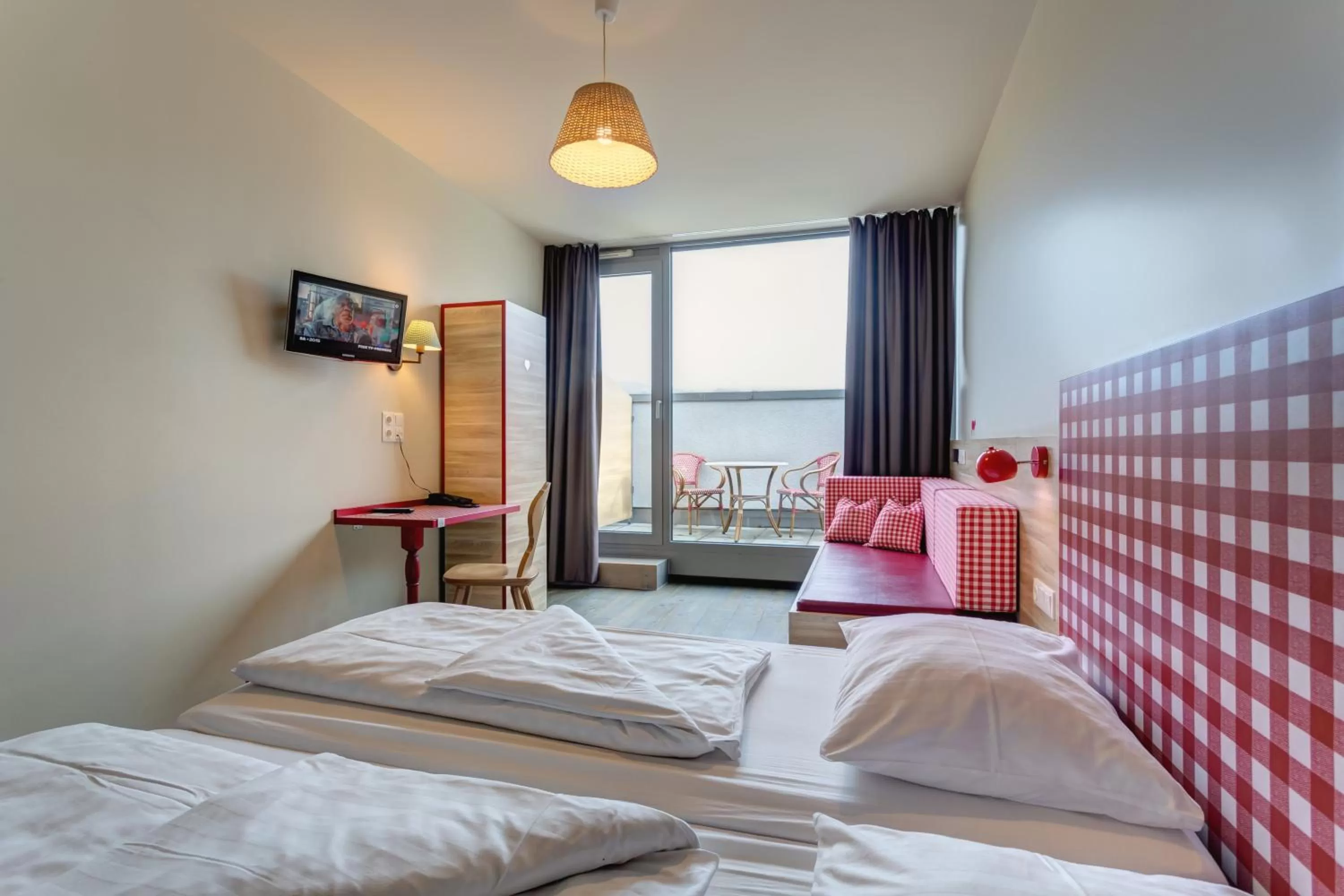 Photo of the whole room, Bed in MEININGER Hotel Salzburg City Center