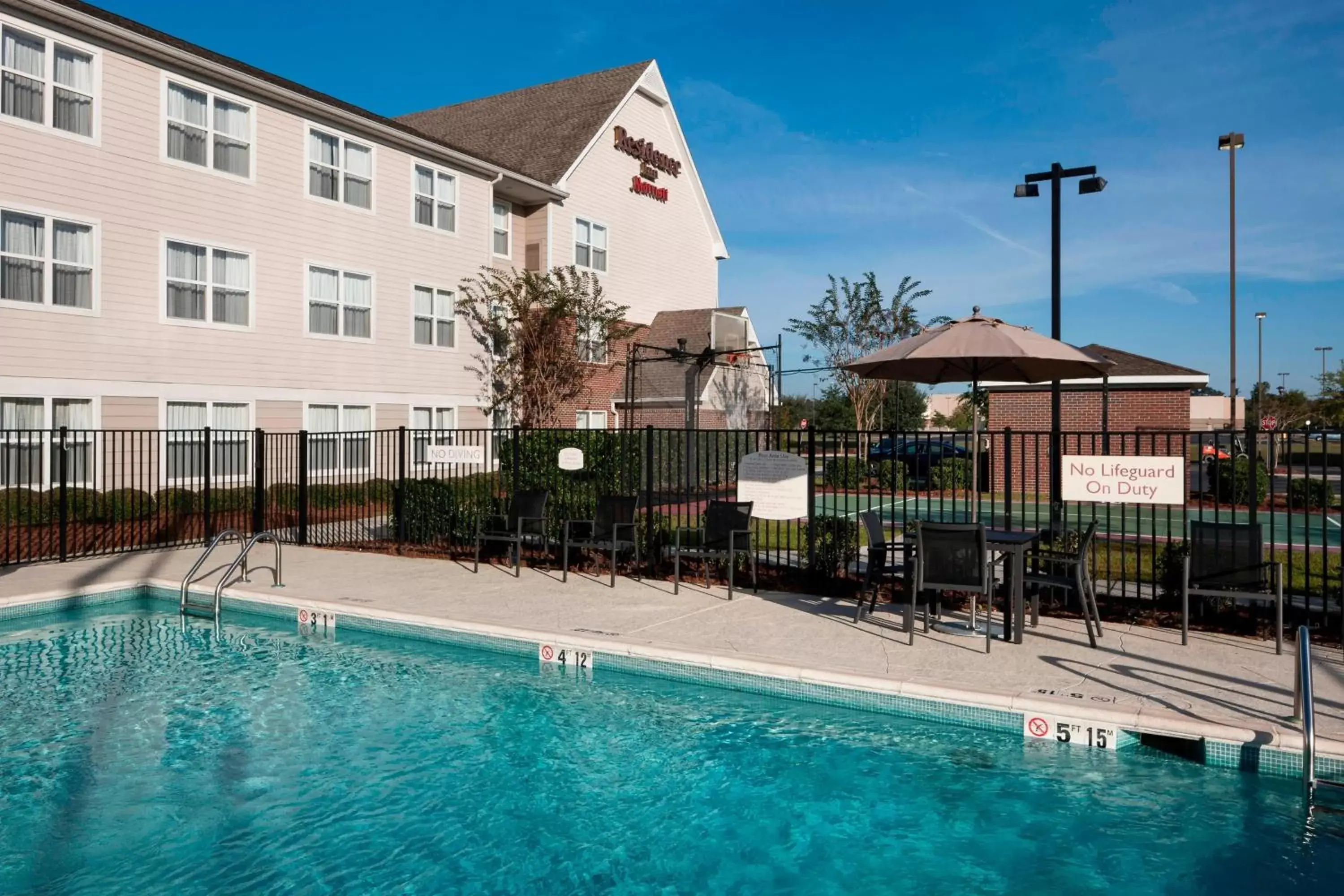 Swimming pool, Property Building in Residence Inn by Marriott Hattiesburg