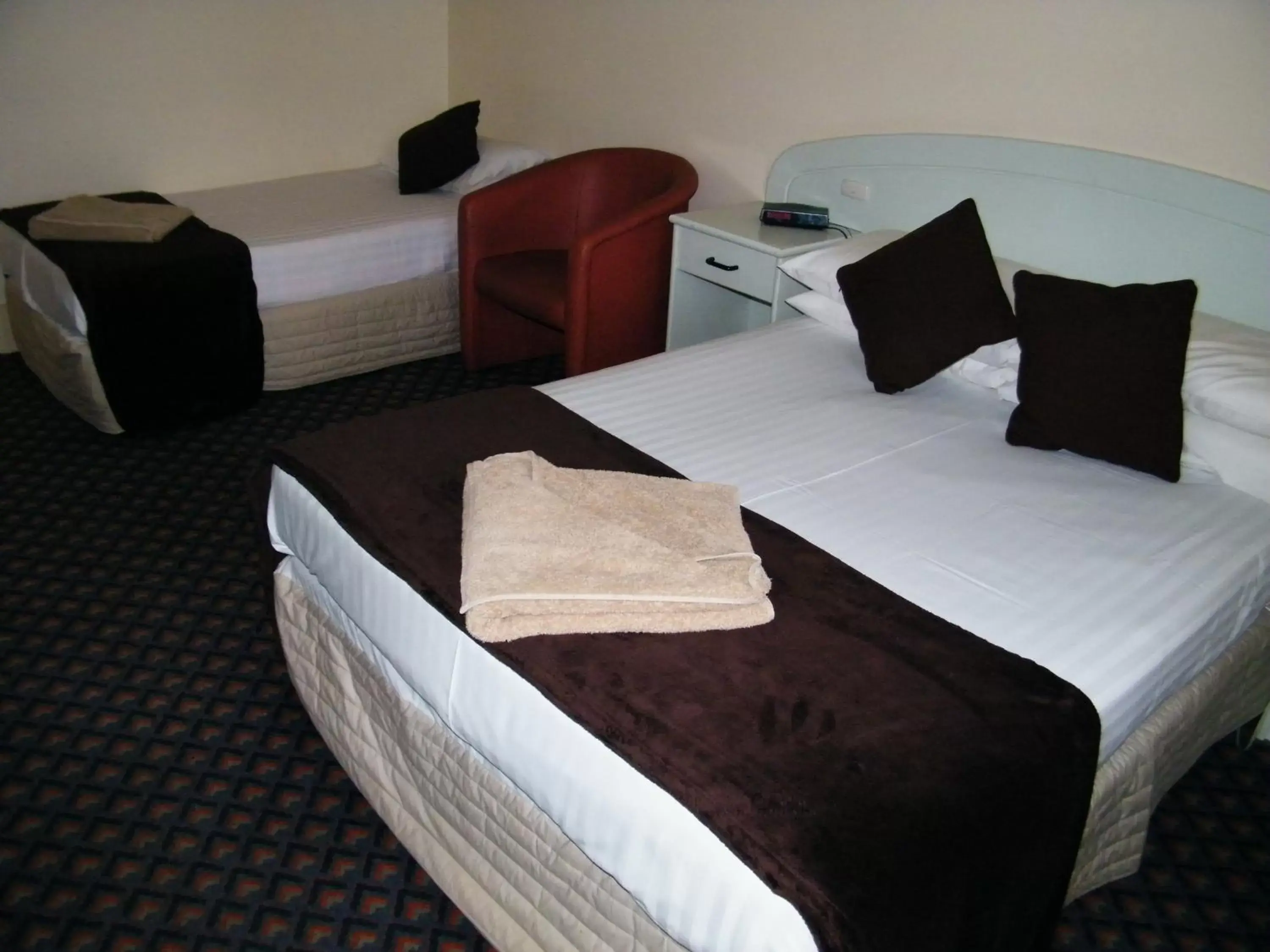 Bed in Grand Tasman Hotel